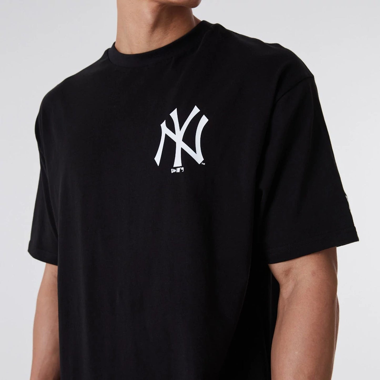 The Male model is wearing New York Yankees Essentials Oversized Black T-Shirt 5