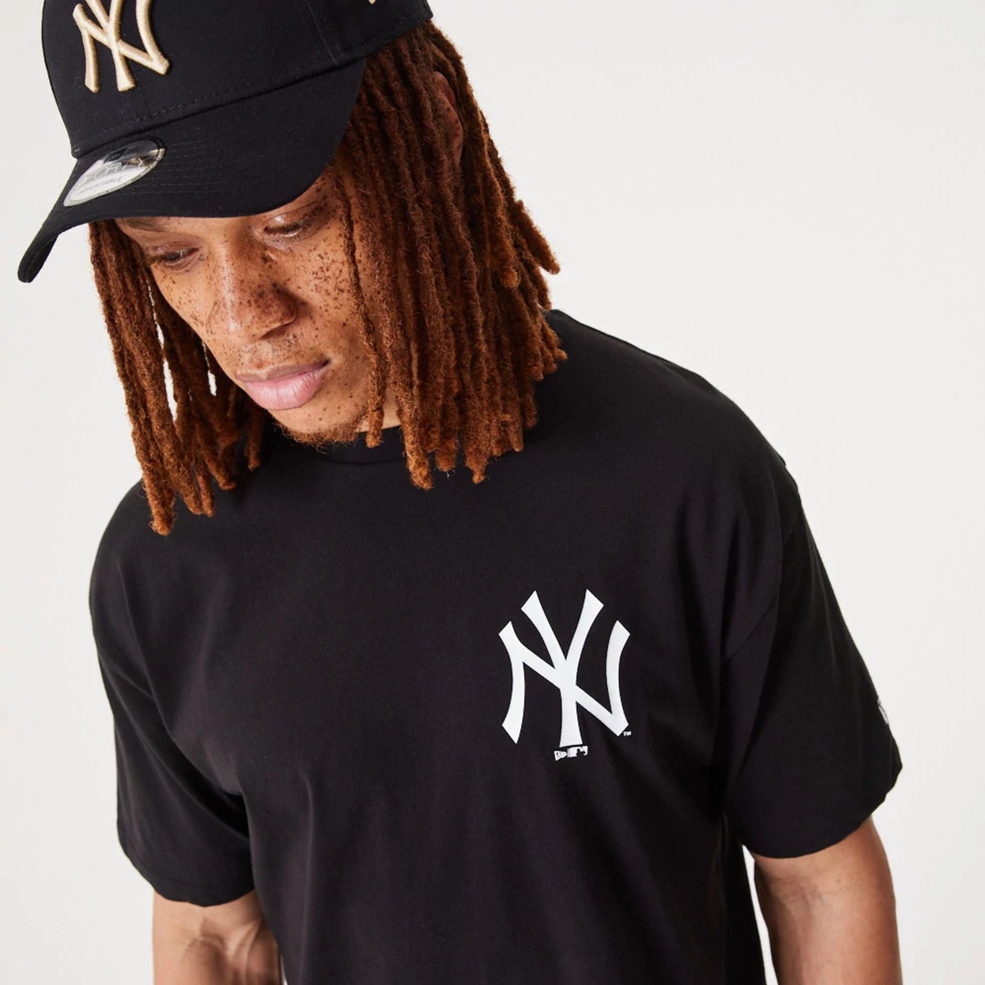 The Male model is wearing New York Yankees Essentials Oversized Black T-Shirt 2