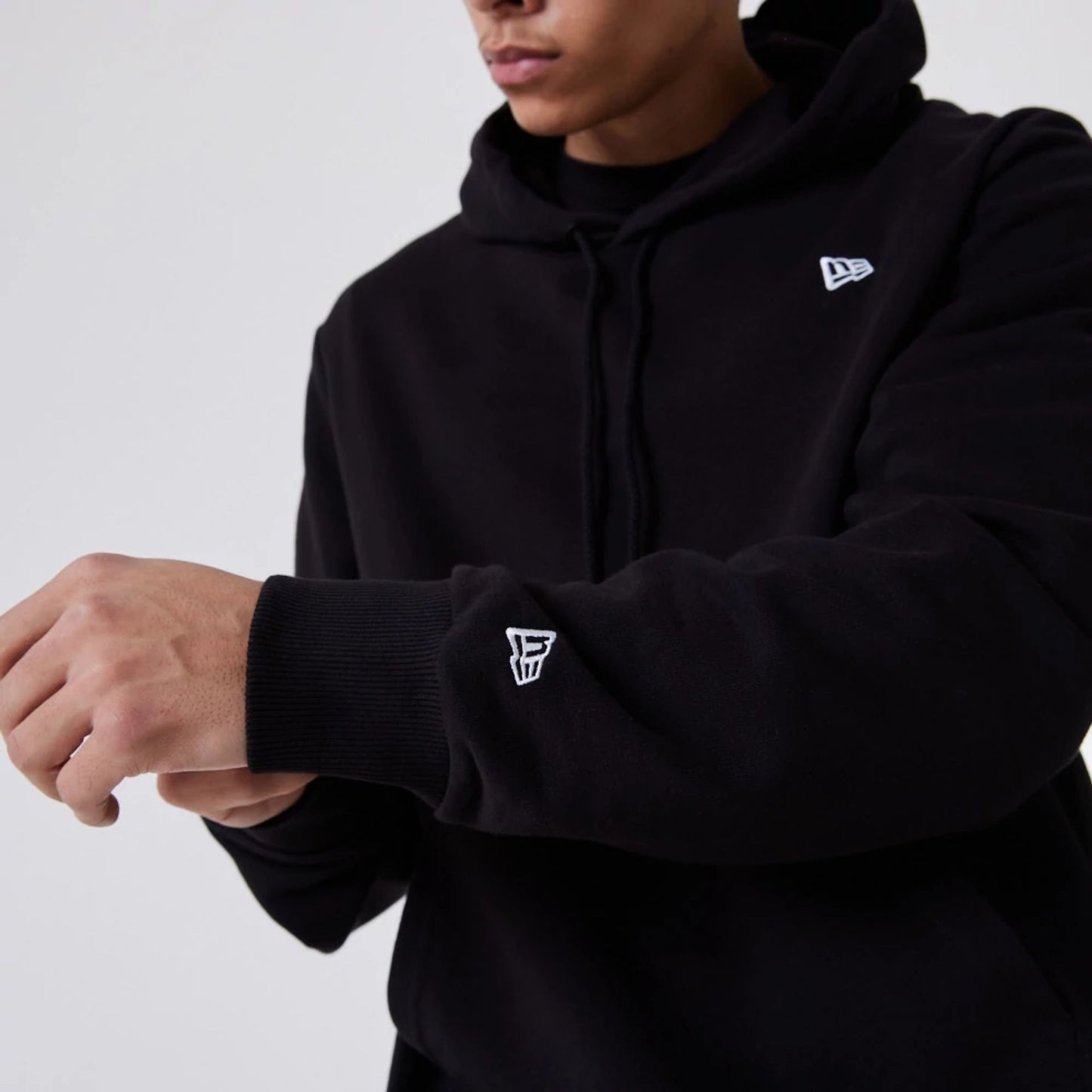 The Male model is wearing New Era Essential Flag Black Hoodie 8