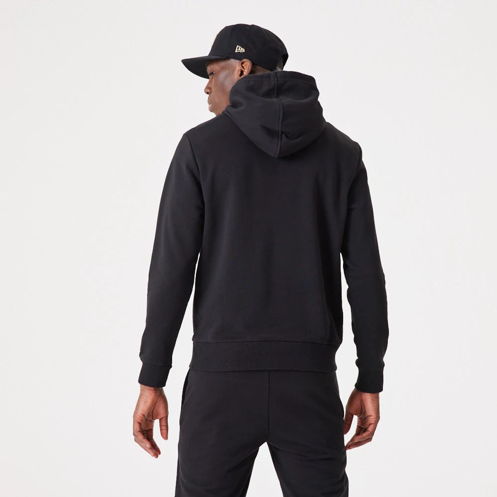 The Male model is wearing New Era Essential Flag Black Hoodie 3