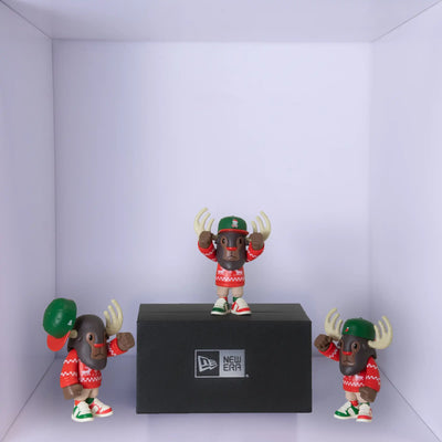 New Era moose figurine wearing a red Christmas jumper and a green hat. 