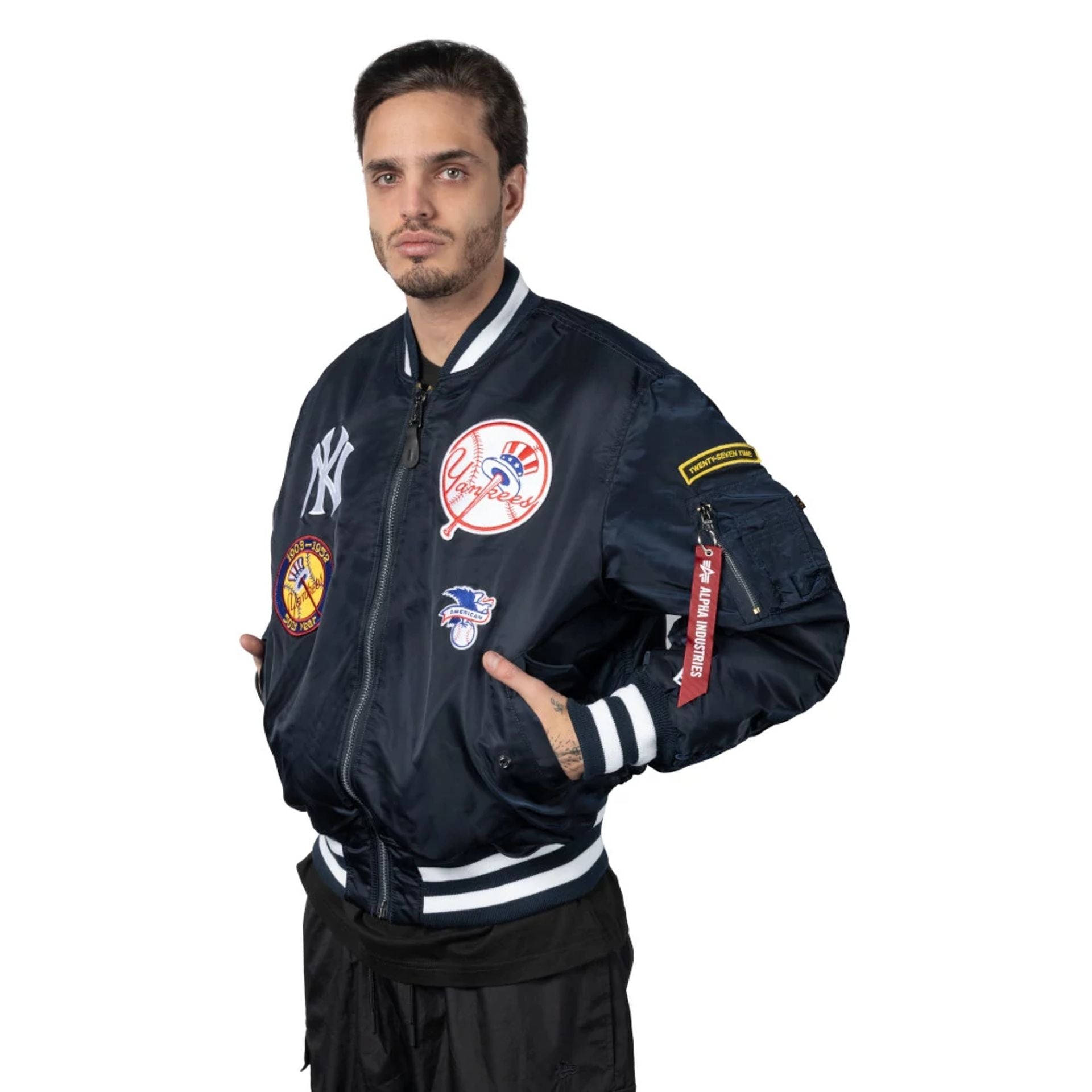 The Male model is wearing New York Yankees Alpha Industries Blue Reversible Bomber Jacket 1