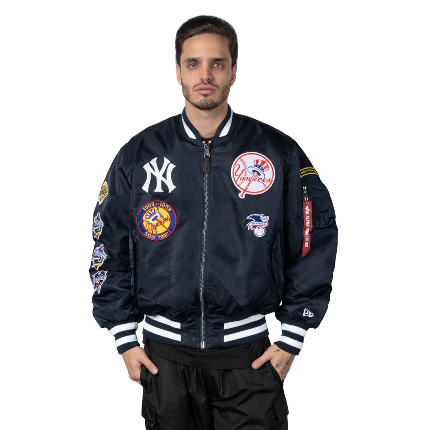 The Male model is wearing New York Yankees Alpha Industries Blue Reversible Bomber Jacket 3