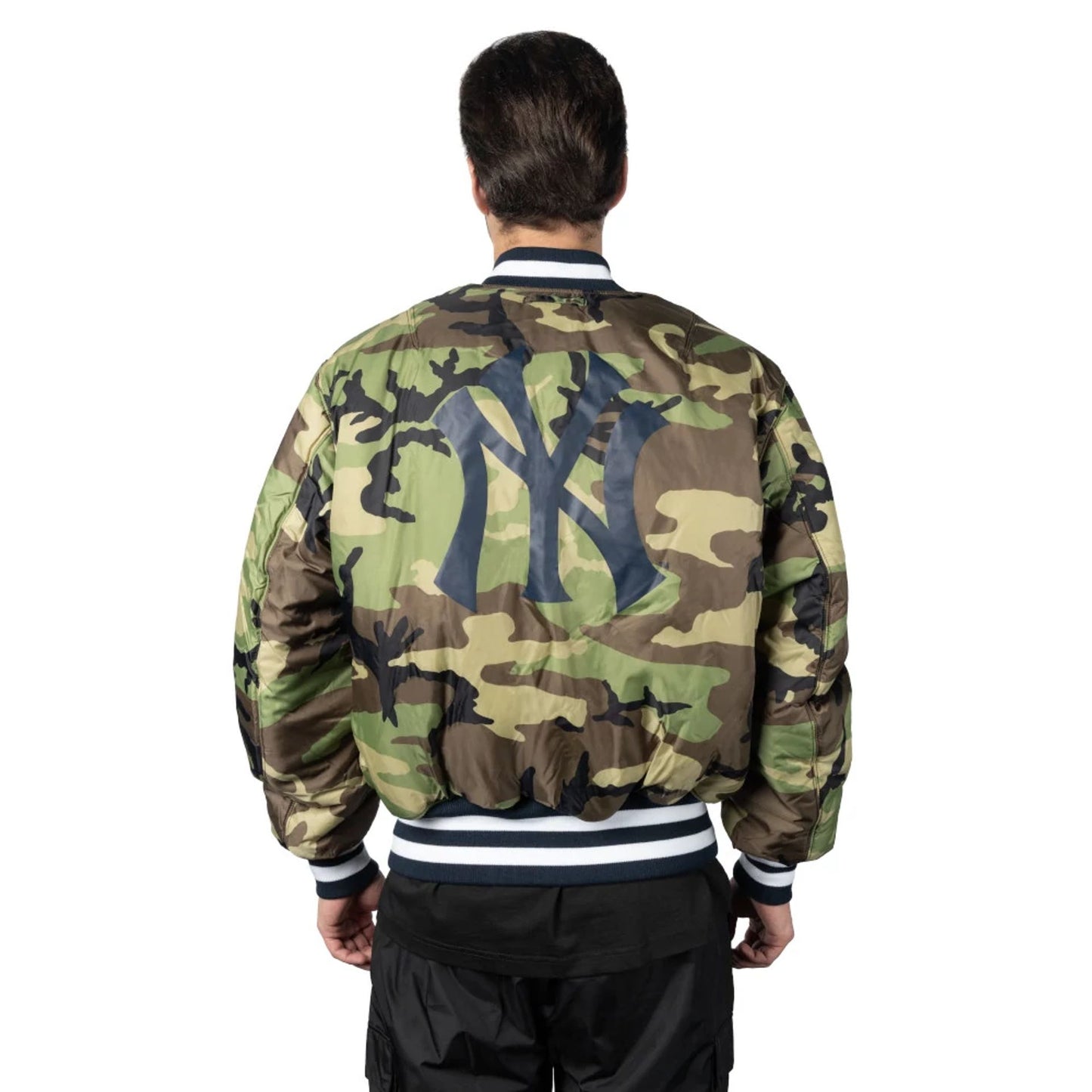 The Male model is wearing New York Yankees Alpha Industries Blue Reversible Bomber Jacket 8