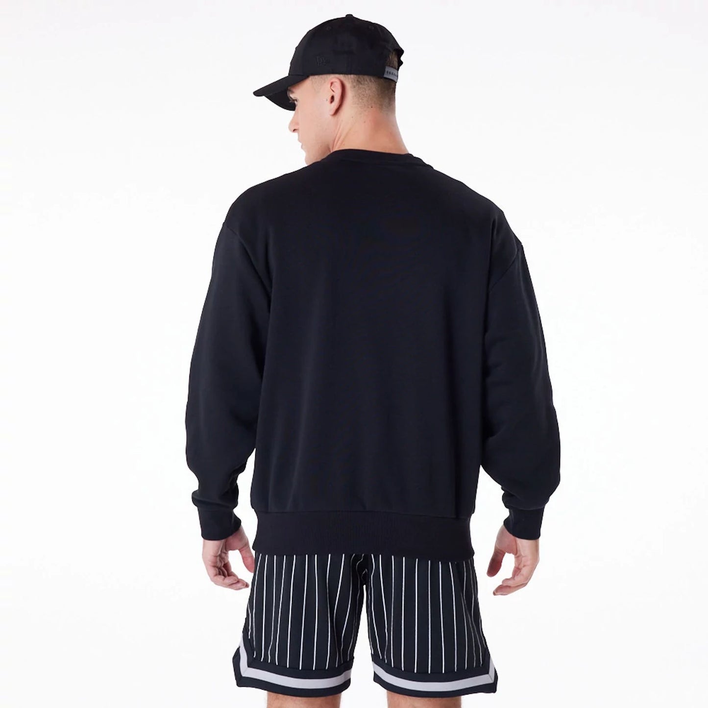 The Male model is wearing New York Yankees New Era Australia Black Oversized Sweater 5