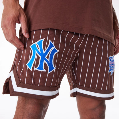 The Male model is wearing New York Yankees Pinstripe New Era Australia Brown Shorts 6