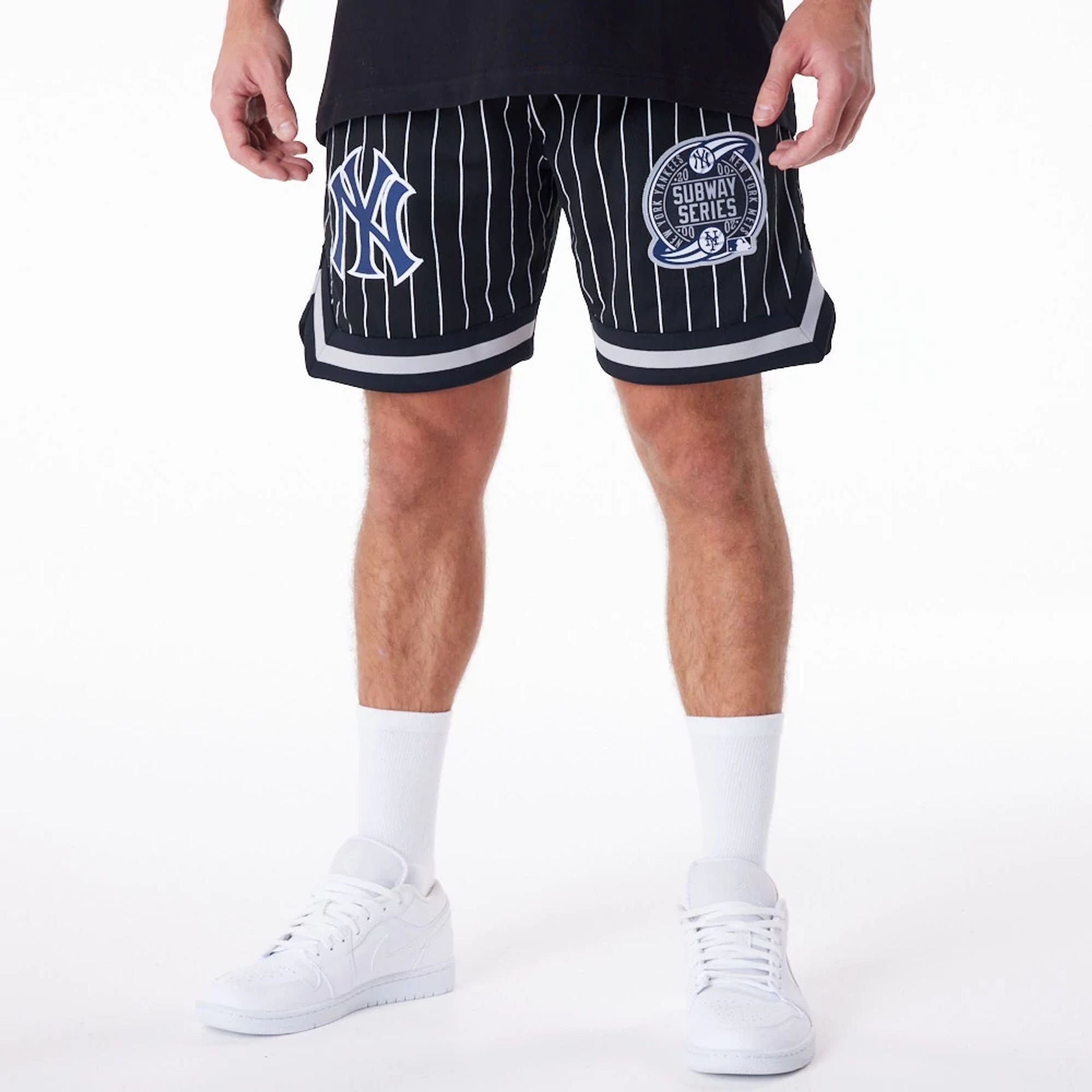 The Male model is wearing New York Yankees Pinstripe New Era Australia Black Shorts 1