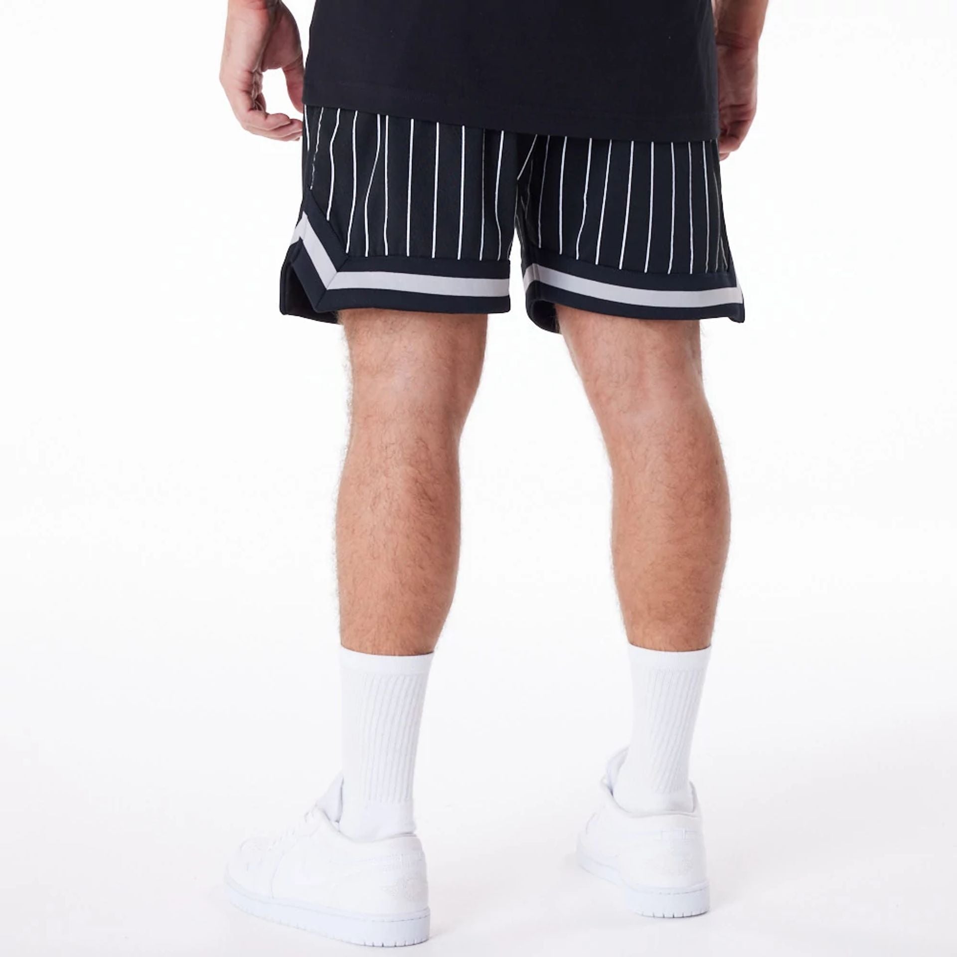 The Male model is wearing New York Yankees Pinstripe New Era Australia Black Shorts 2