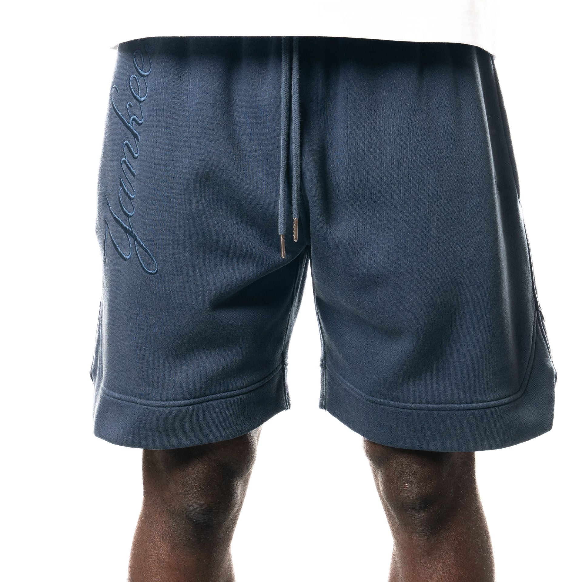 The Male model is wearing New York Yankees New Era Australia Dark Blue Fleece Shorts  1