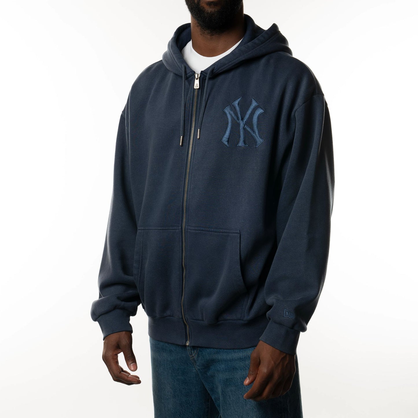 The Male model is wearing New York Yankees New Era Australia Dark Blue Oversized Full Zip Hoodie  3