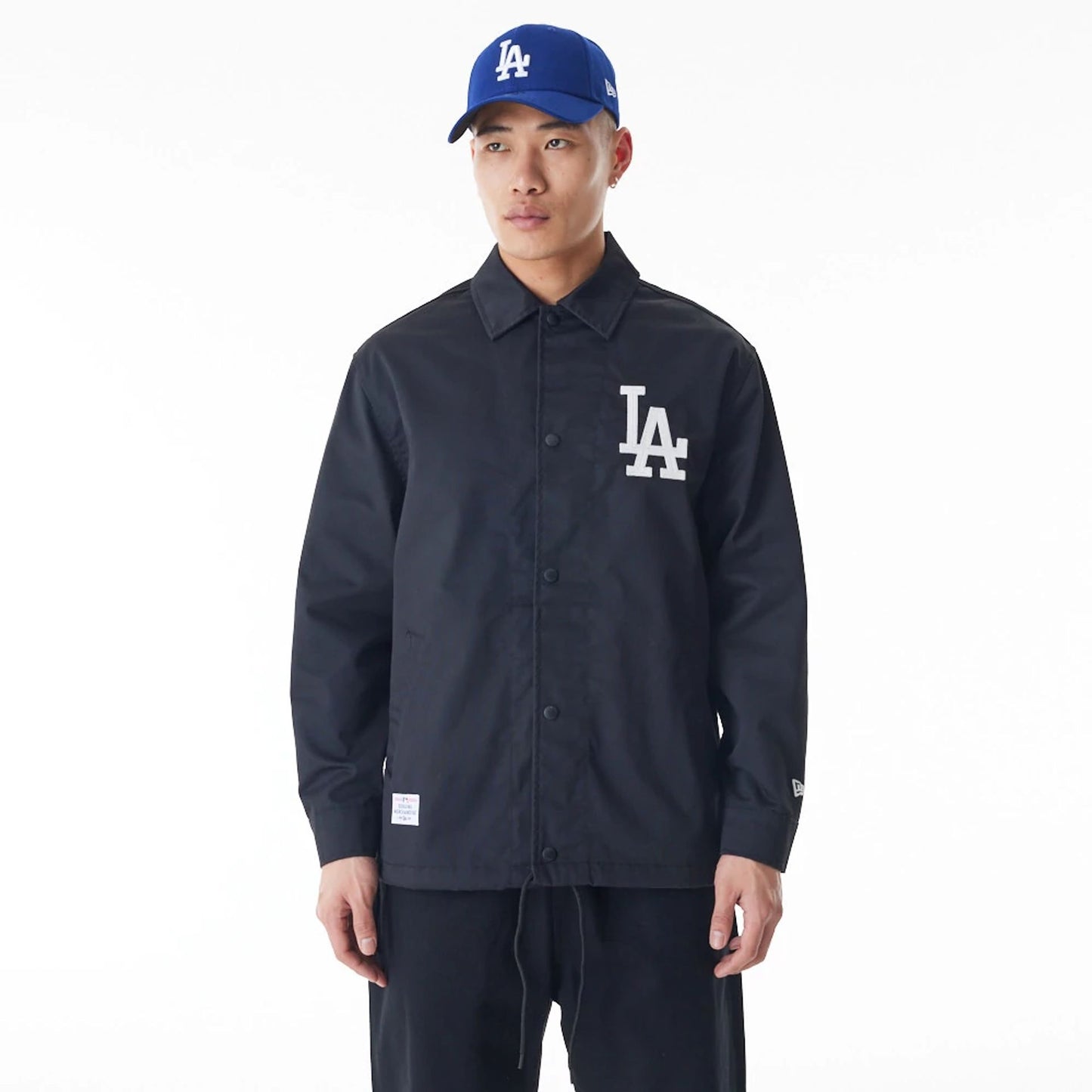 The Male model is wearing LA Dodgers New Era Korea MLB Coach Black Jacket 1