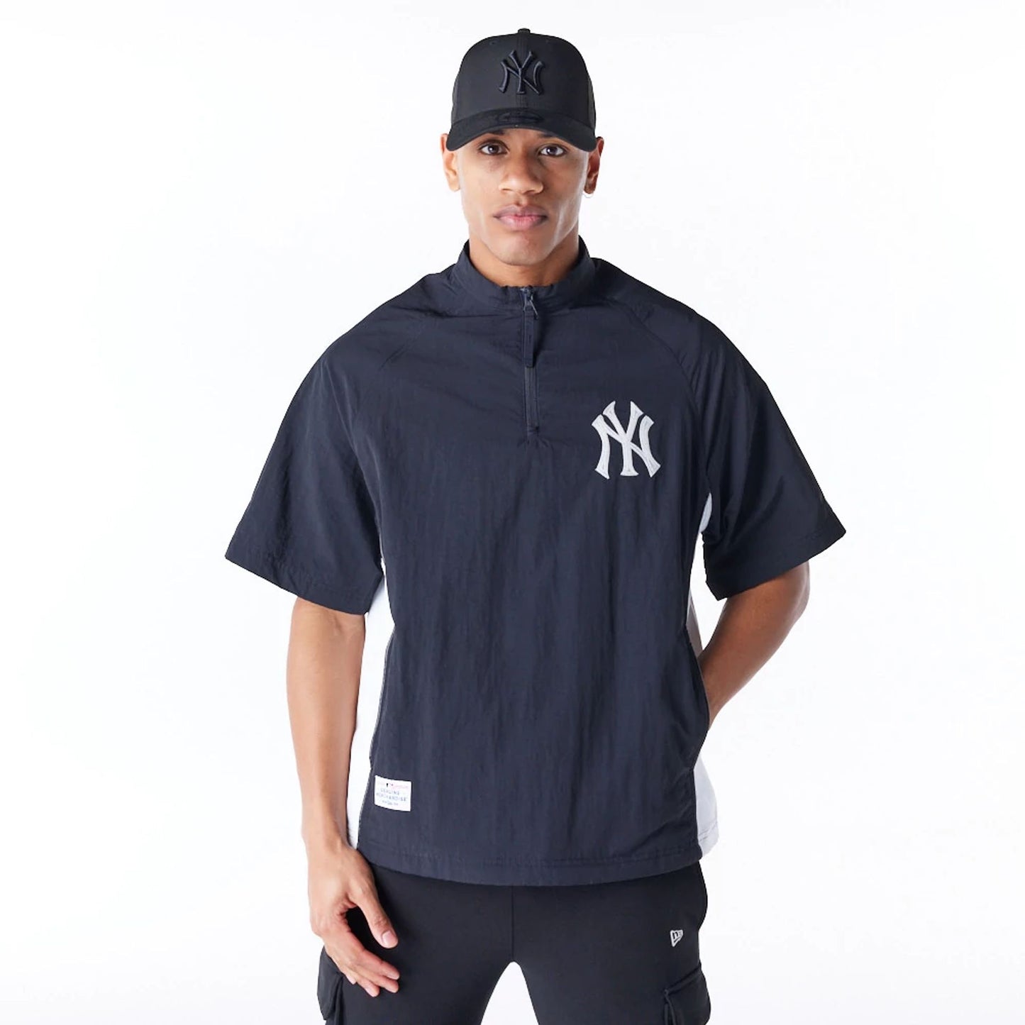 The Male model is wearing New Era Korea MLB New York Yankees Black Short Sleeve Anorak 1