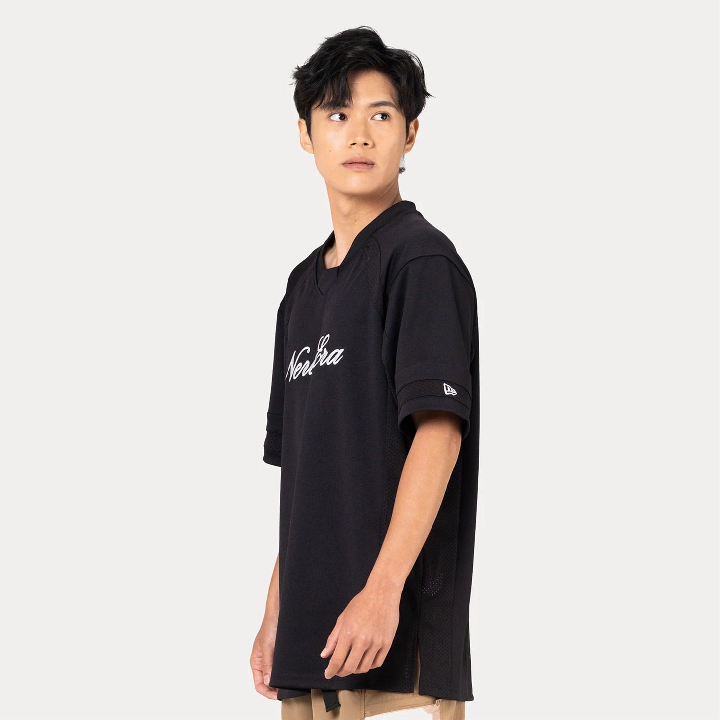 The Male model is wearing New Era Heritage Black Football Jersey  2