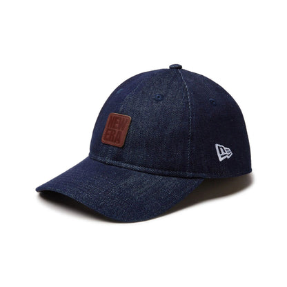 This is a New Era Japan Denim Leather Patch Dark Blue 9TWENTY Adjustable Cap 1