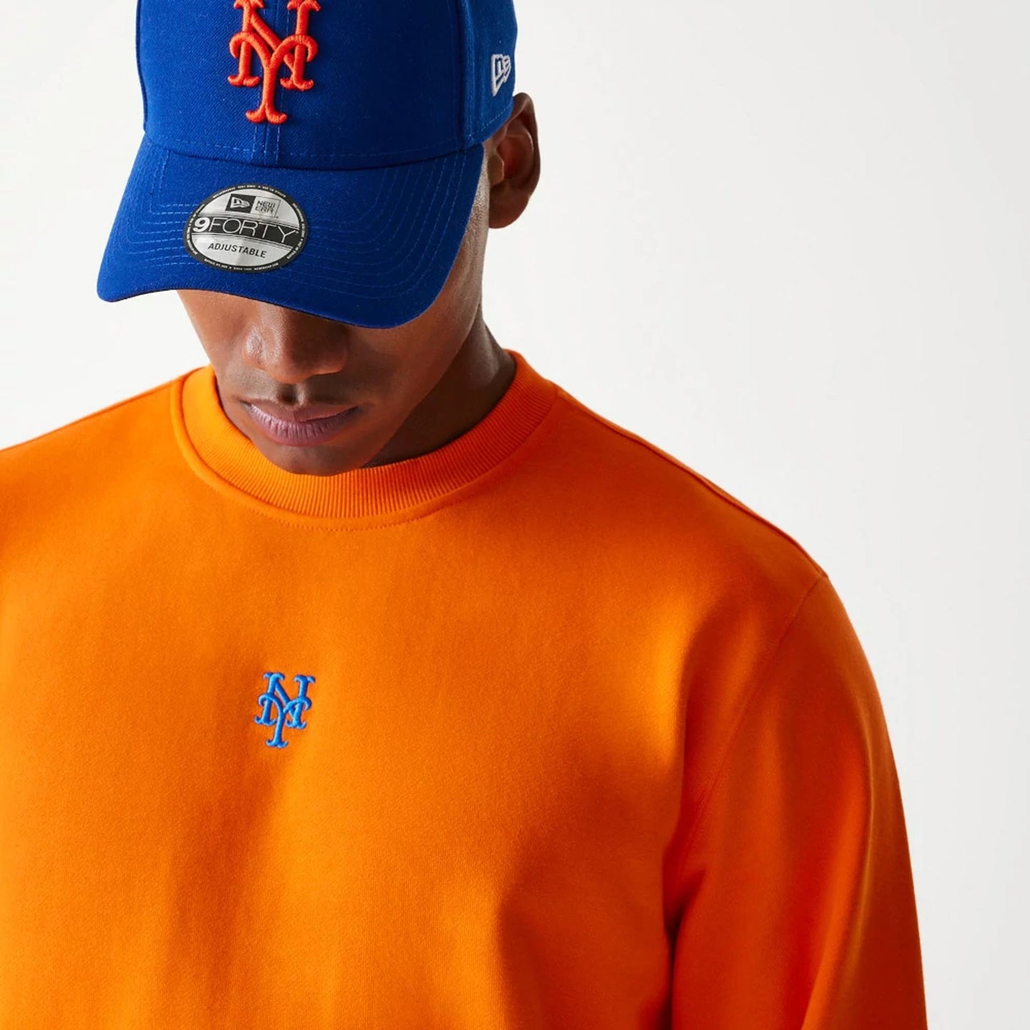 The Male model is wearing New York Mets Korea Orange Sweatshirt 4