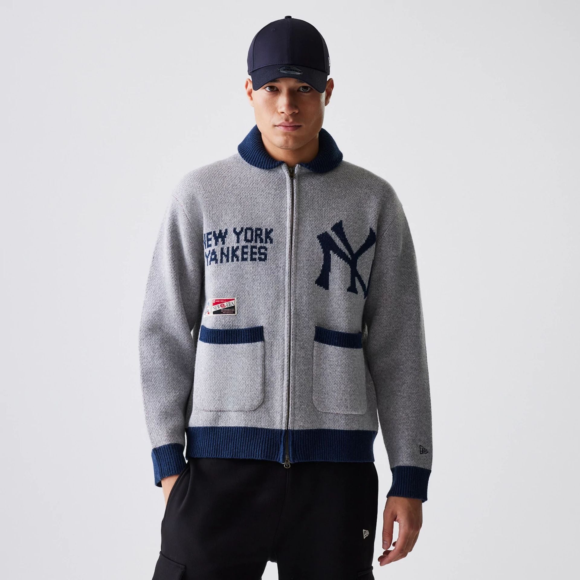 The Male model is wearing New York Yankees MLB Cowichan Grey Knitted Zip Through 1