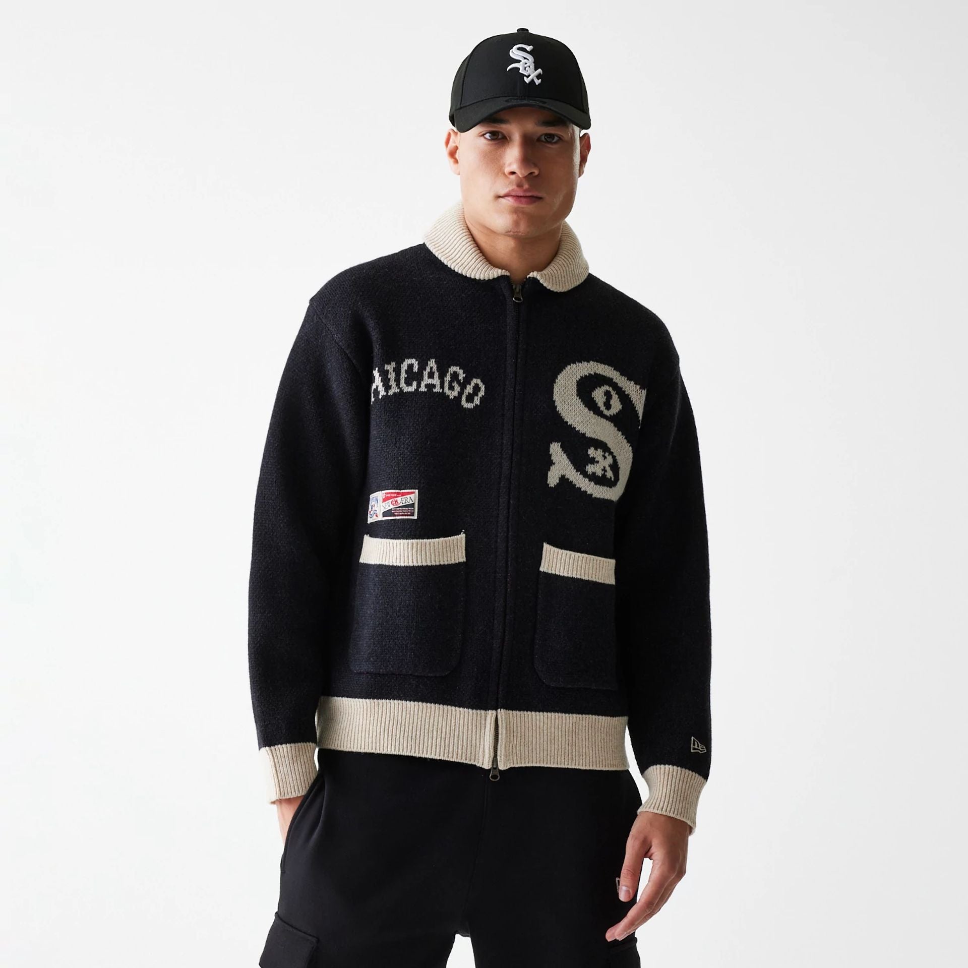 The Male model is wearing Chicago White Sox MLB Cowichan Black Crew Neck Sweater  1