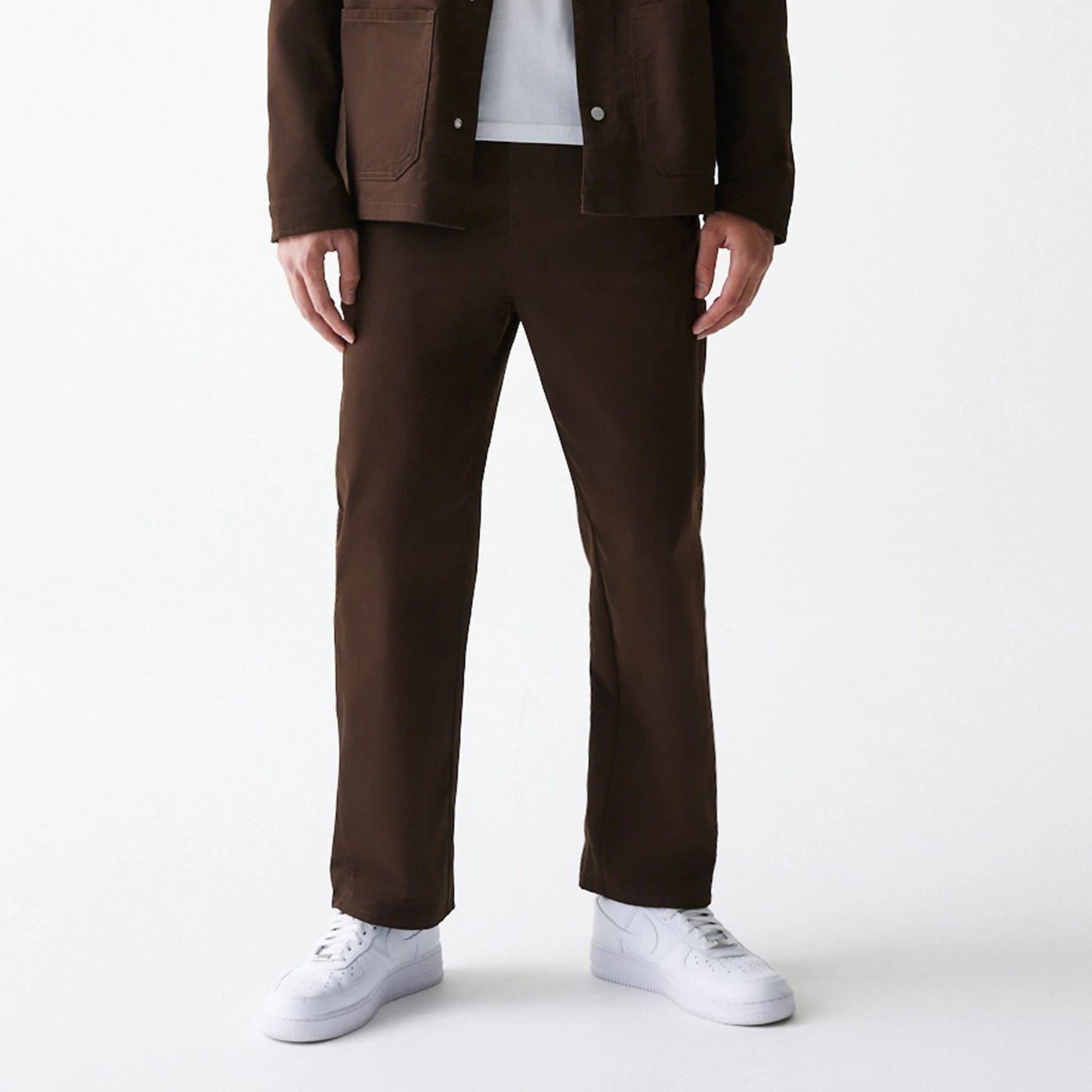 The Male model is wearing New Era Dark Brown Heavy Duty Trousers 1