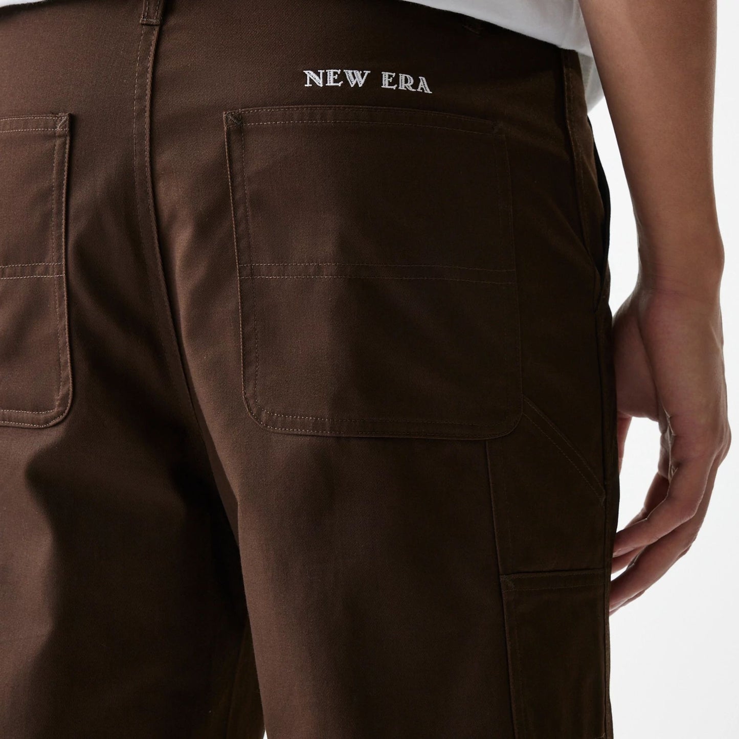 The Male model is wearing New Era Dark Brown Heavy Duty Trousers 3