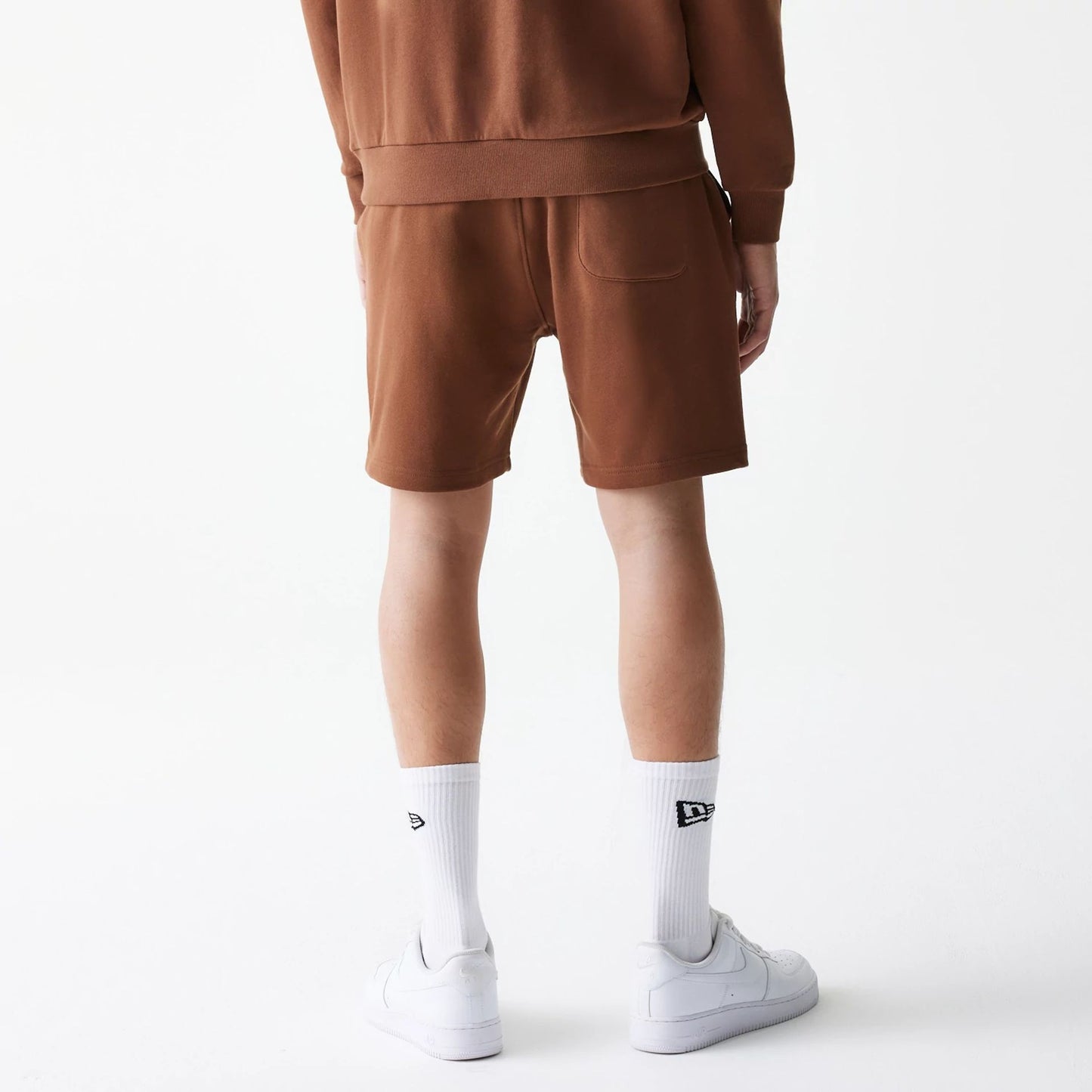 The Male model is wearing New Era Tonal Brown Shorts  2