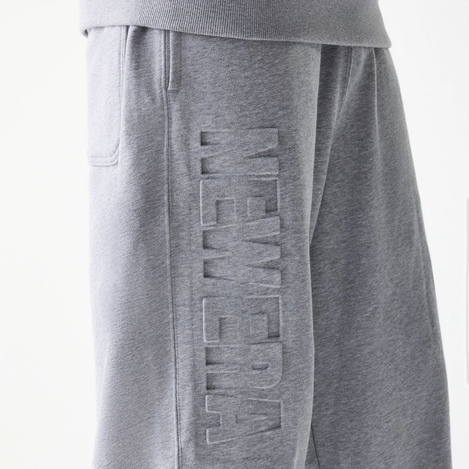 The Male model is wearing New Era Tonal Grey Joggers  3