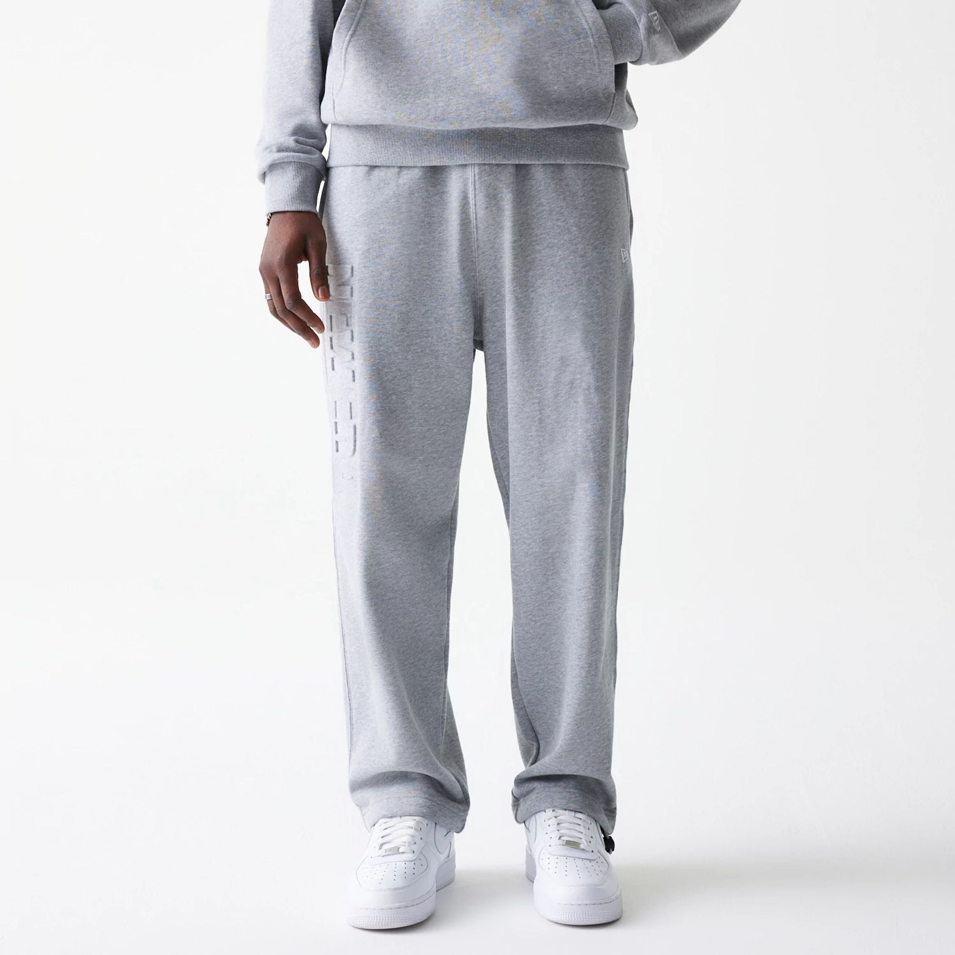 The Male model is wearing New Era Tonal Grey Joggers  6