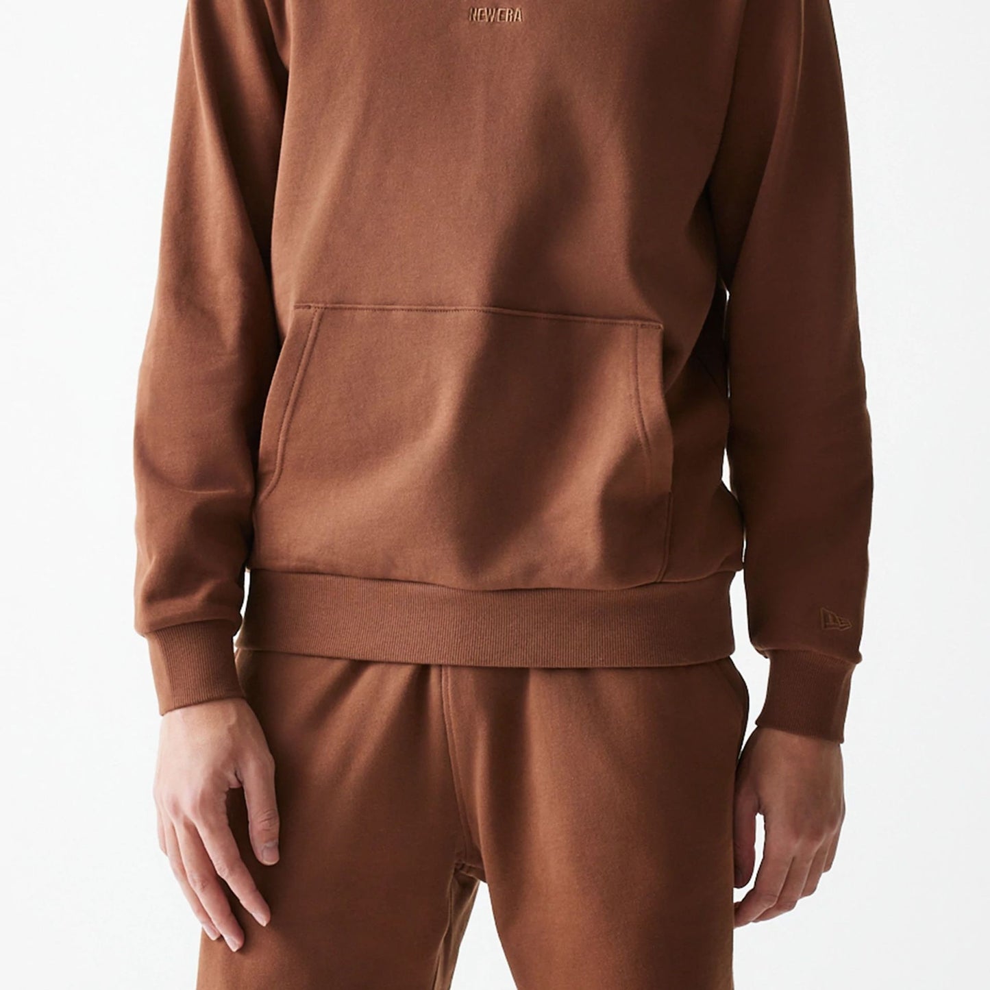 The Male model is wearing New Era Tonal Brown Pullover Hoodie  5