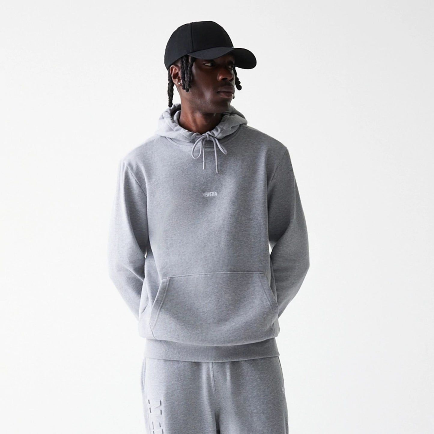 The Male model is wearing New Era Tonal Grey Pullover Hoodie  3