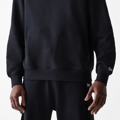 The Male model is wearing Ode To NY Black Pullover Hoodie 6