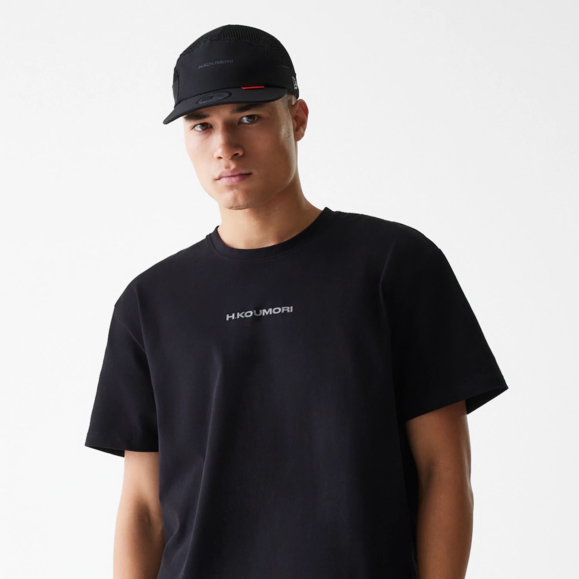 The Male model is wearing Hermanos Koumori x New Era Black T-Shirt 6