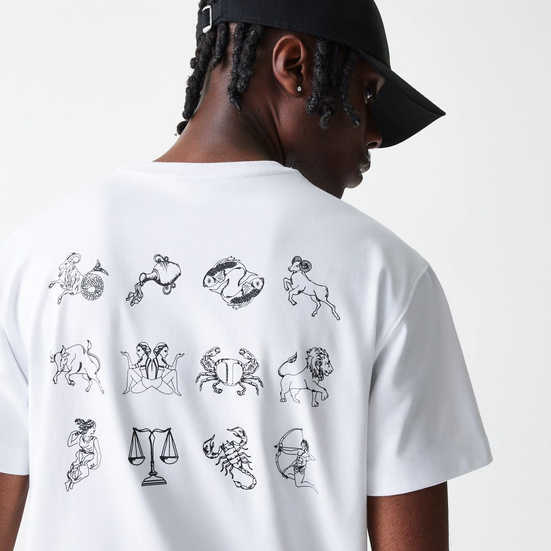 The Male model is wearing New Era Zodiac White T-Shirt 4