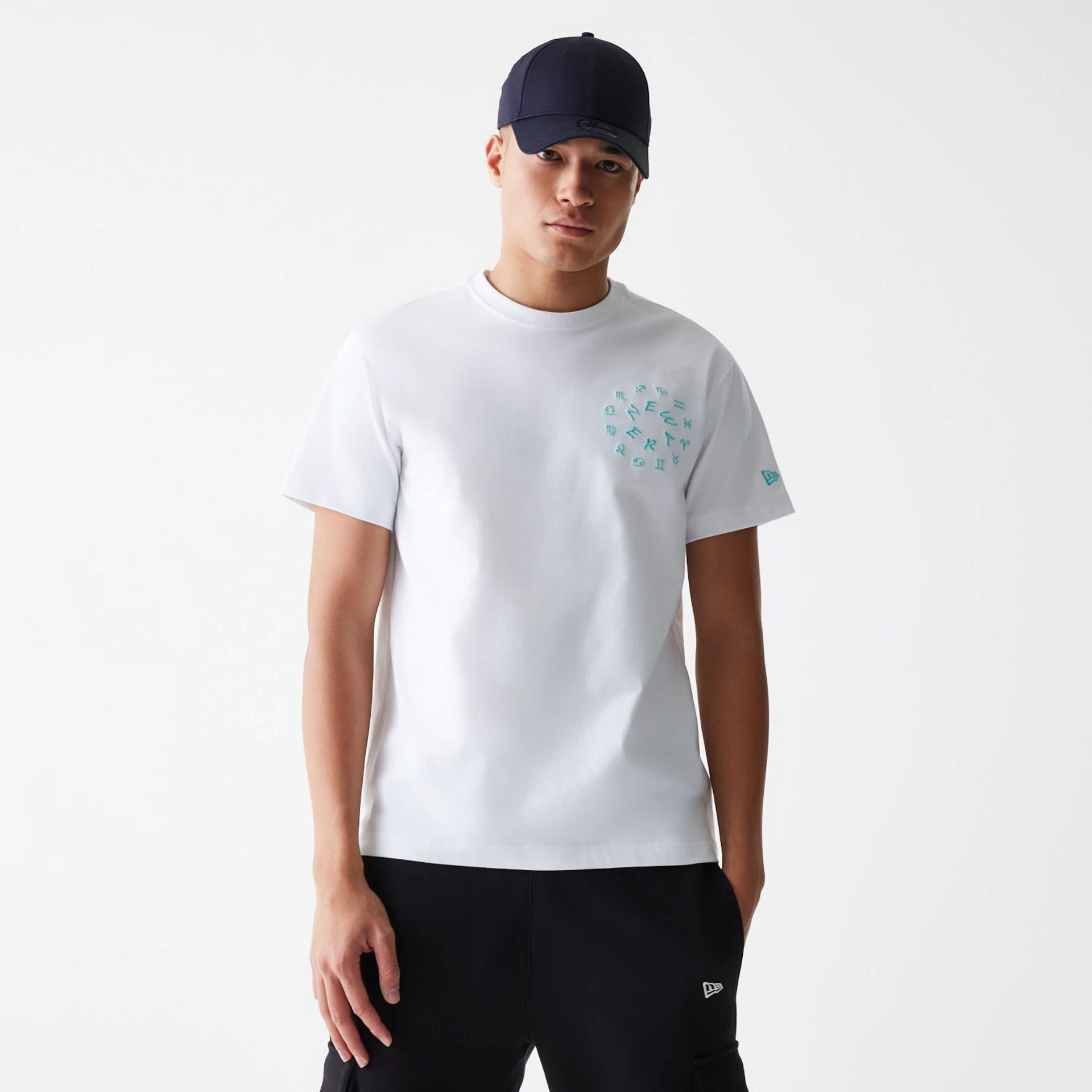 The Male model is wearing New Era Horoscope White T-Shirt 1