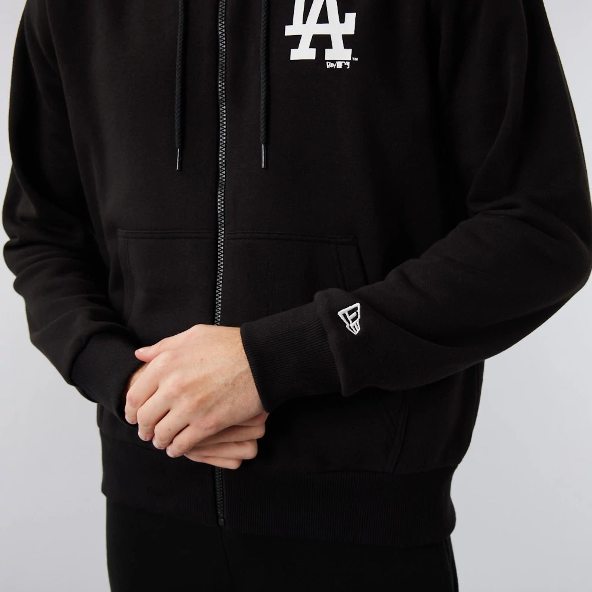 The Male model is wearing LA Dodgers MLB League Essential Black Full-Zip Hoodie 3