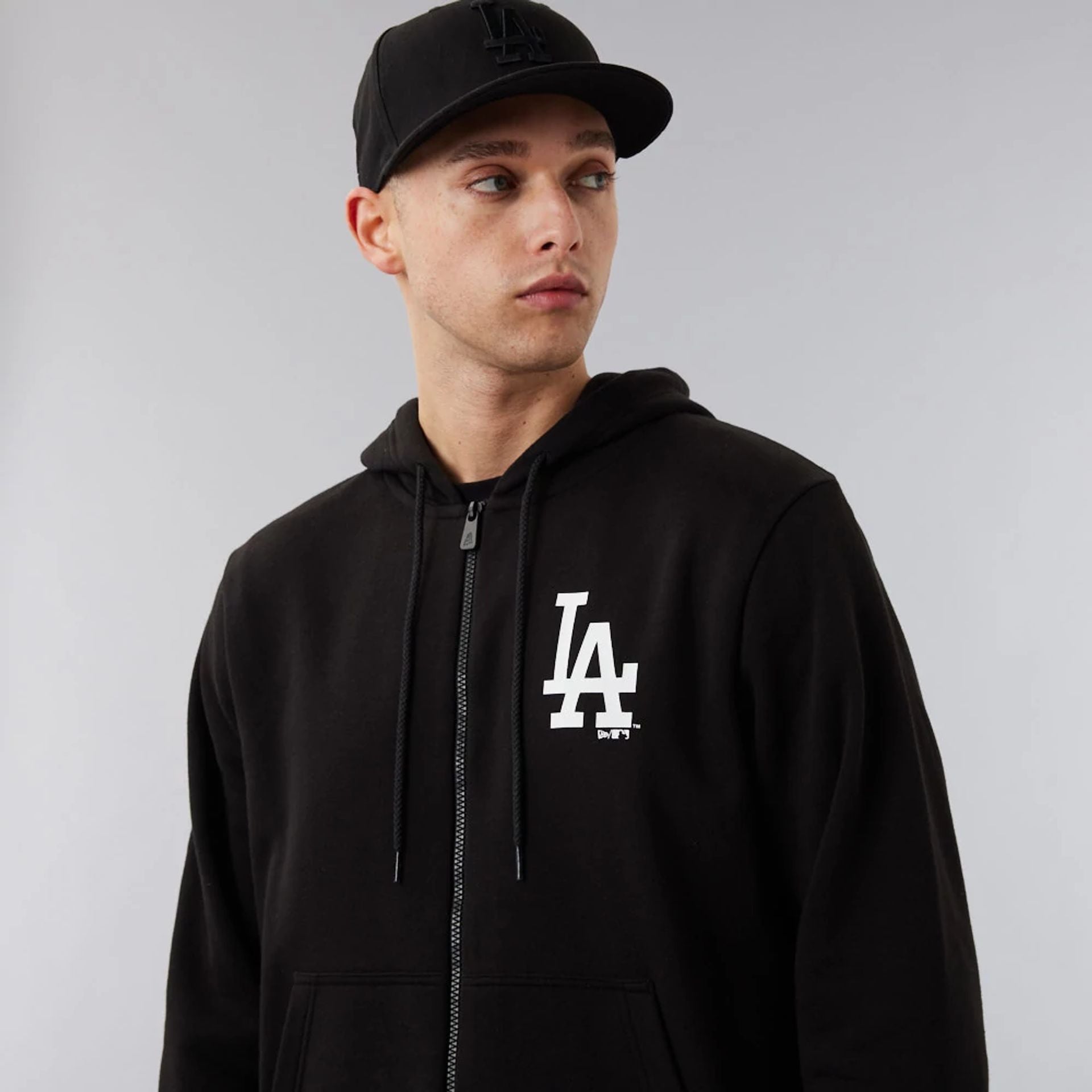 The Male model is wearing LA Dodgers MLB League Essential Black Full-Zip Hoodie 4