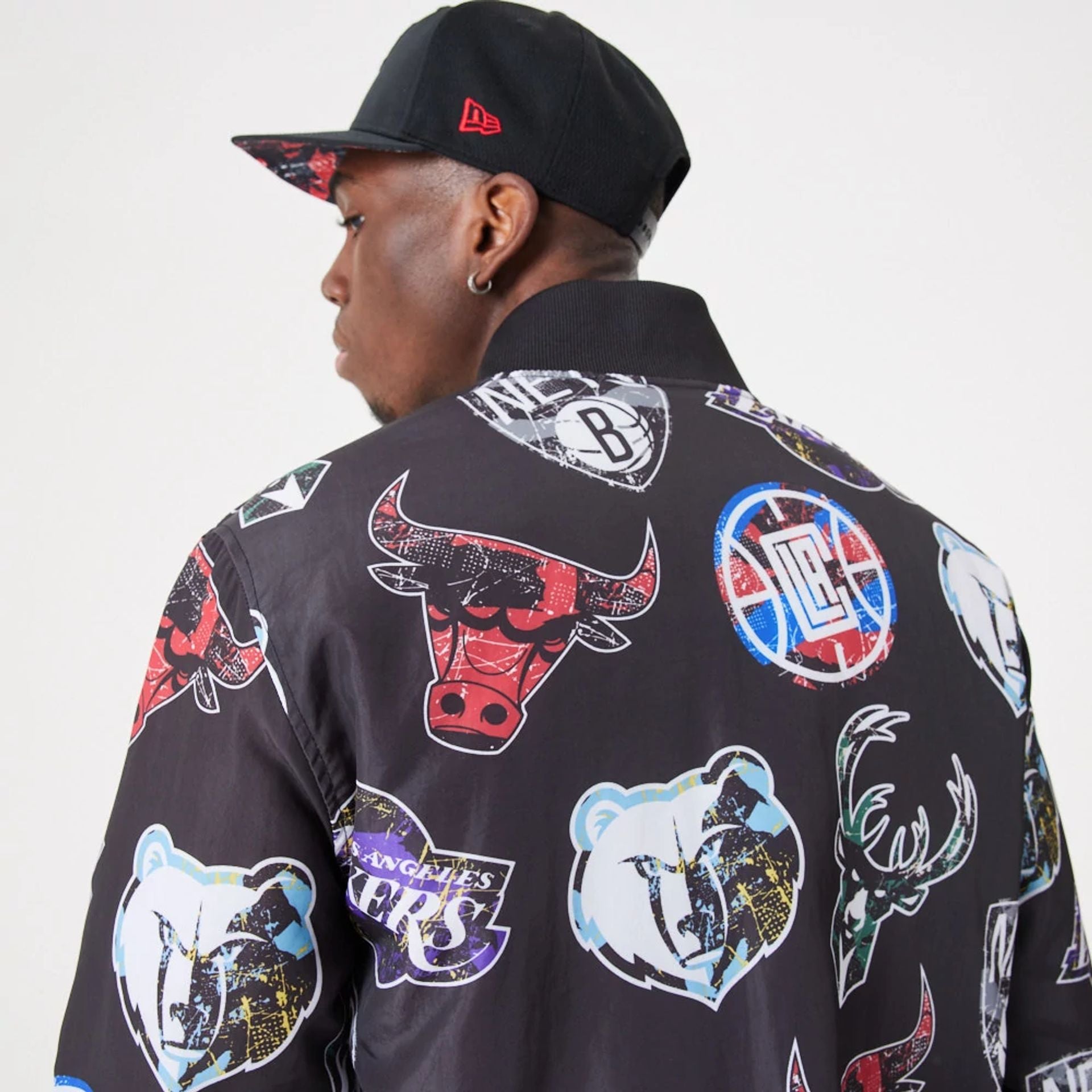 The Male model is wearing NBA All Over Print Team Logos Black Bomber Jacket 7