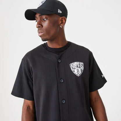 The Male model is wearing Brooklyn Nets NBA Infill Team Logo Black Jersey 6