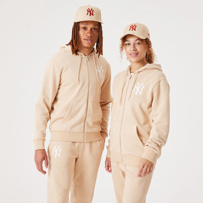 The Male model is wearing New York Yankees MLB League Essential Light Beige Full-Zip Hoodie 1