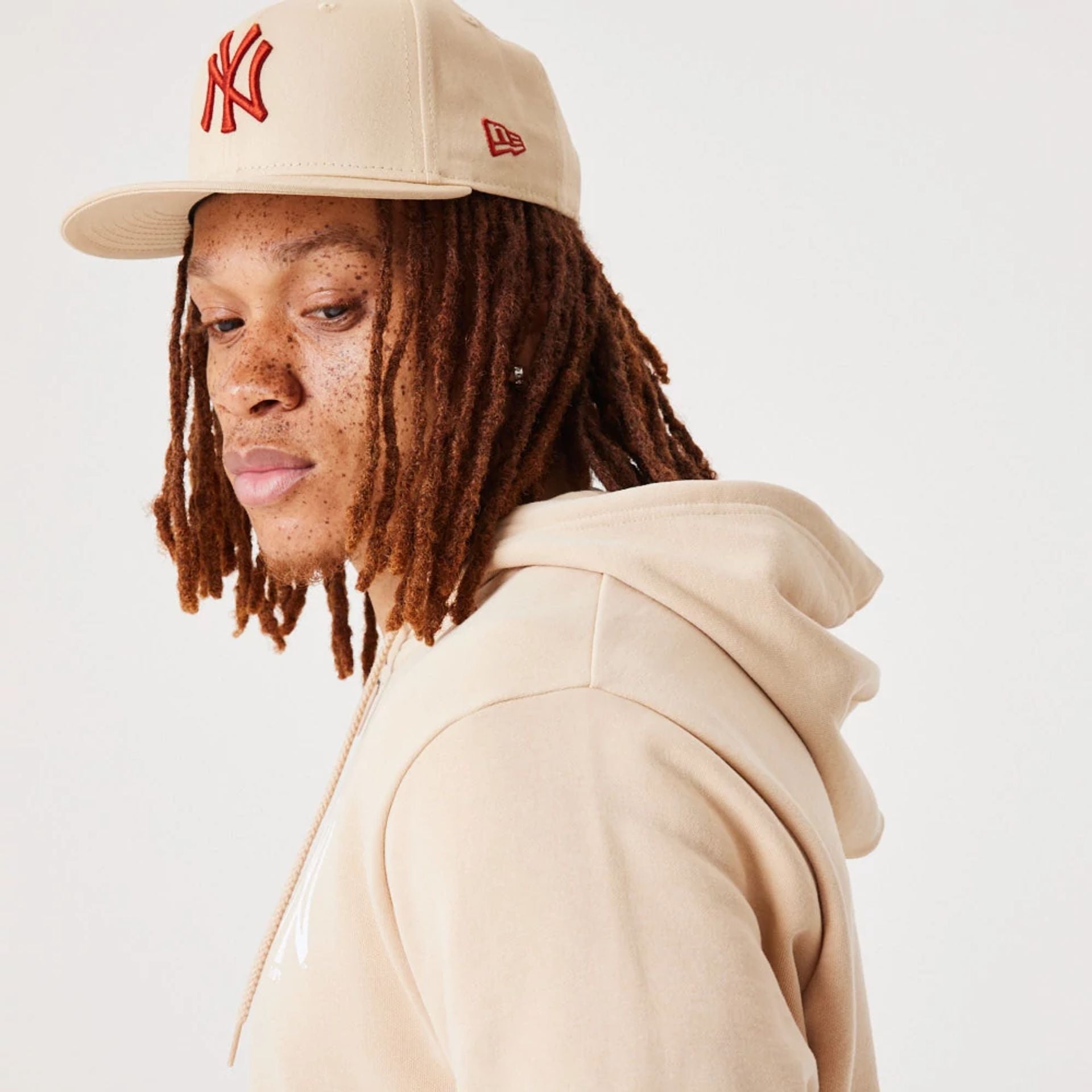 The Male model is wearing New York Yankees MLB League Essential Light Beige Full-Zip Hoodie 8