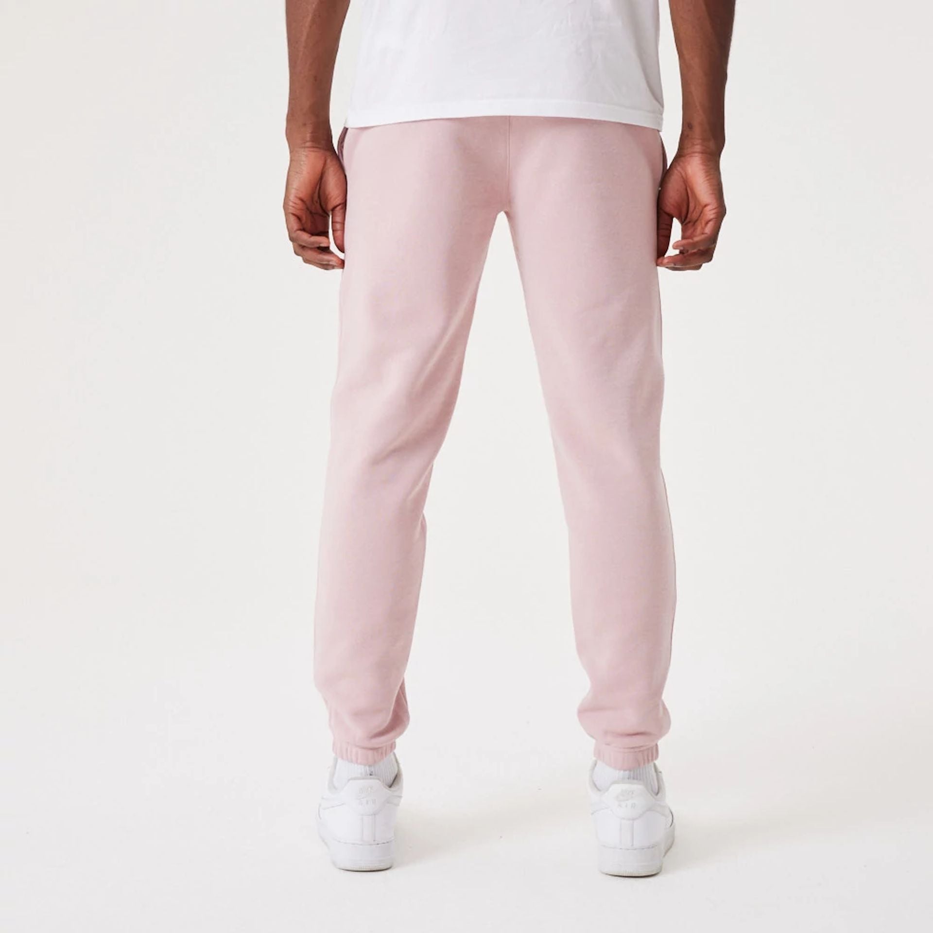 The Male model is wearing New York Yankees MLB League Essential Pastel Pink Joggers 2