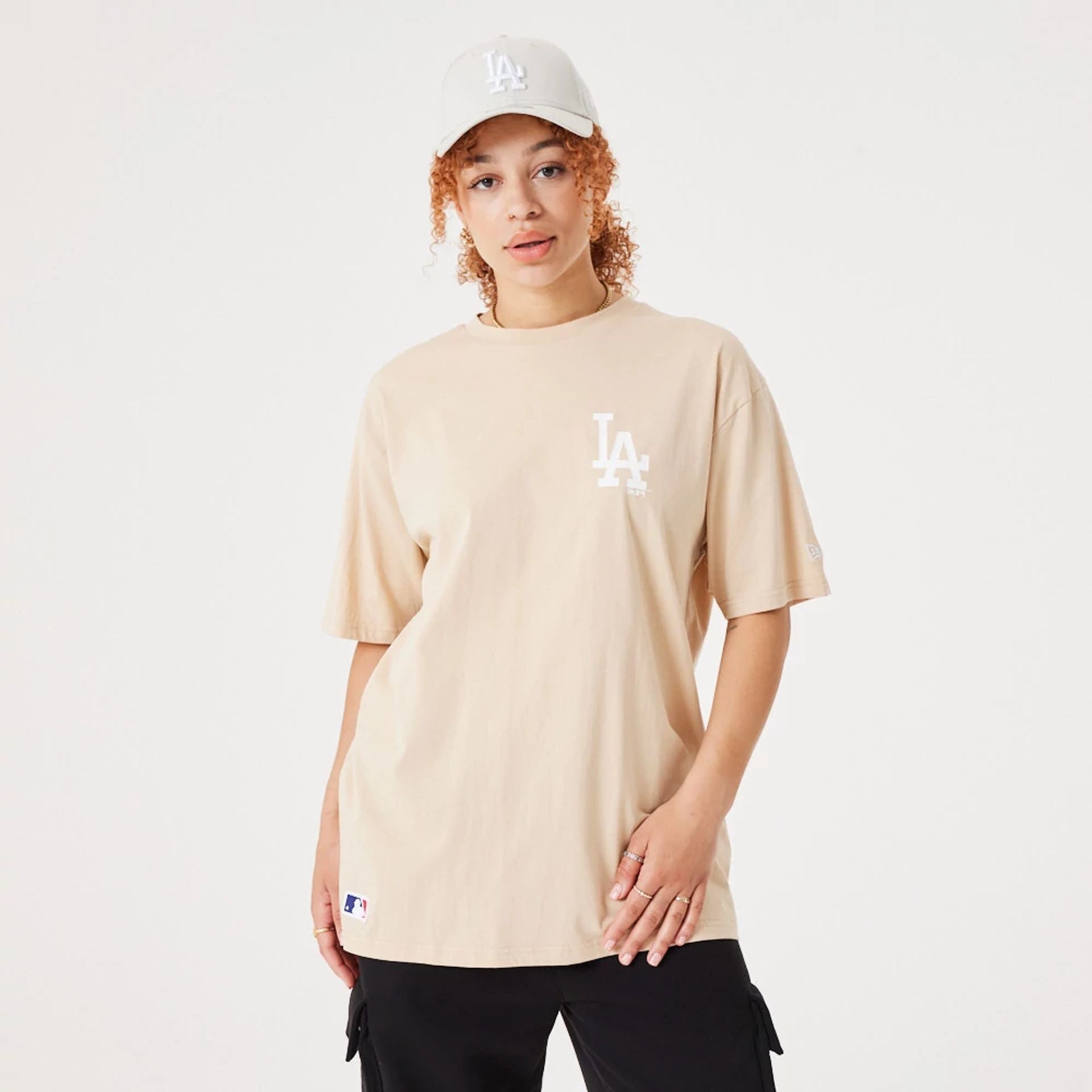 The Male model is wearing LA Dodgers MLB League Essential Light Beige Oversized T-Shirt 3