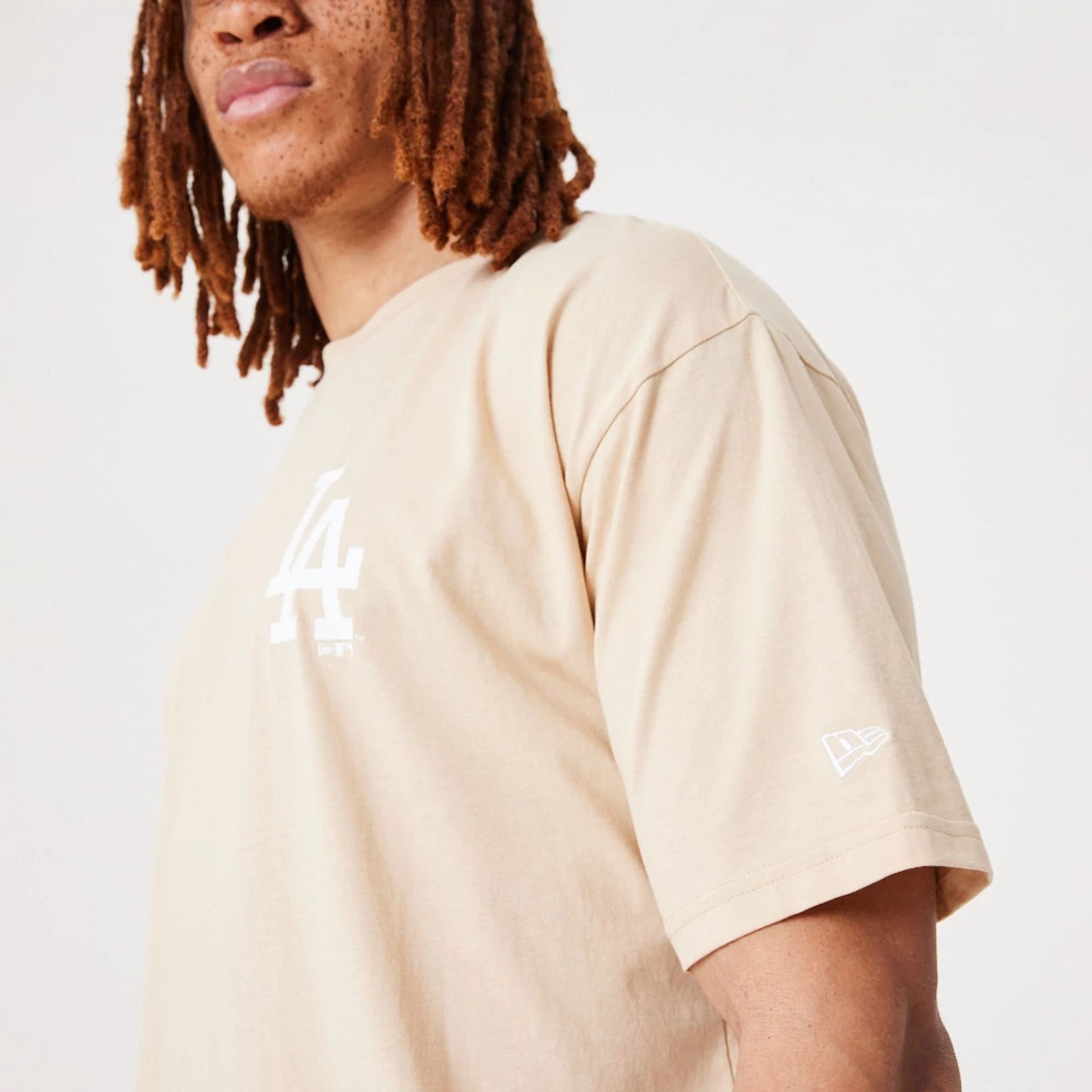 The Male model is wearing LA Dodgers MLB League Essential Light Beige Oversized T-Shirt 4