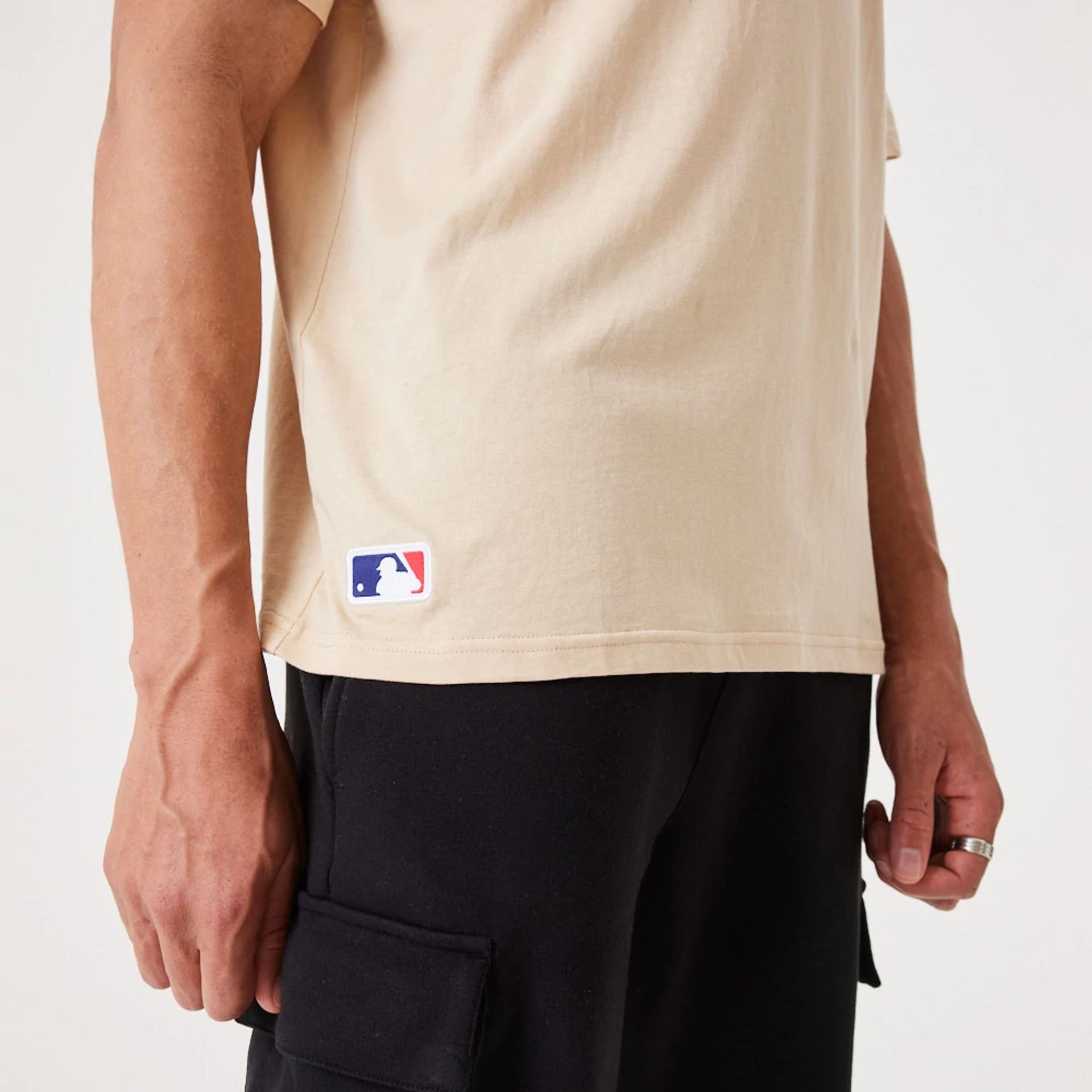 The Male model is wearing LA Dodgers MLB League Essential Light Beige Oversized T-Shirt 5