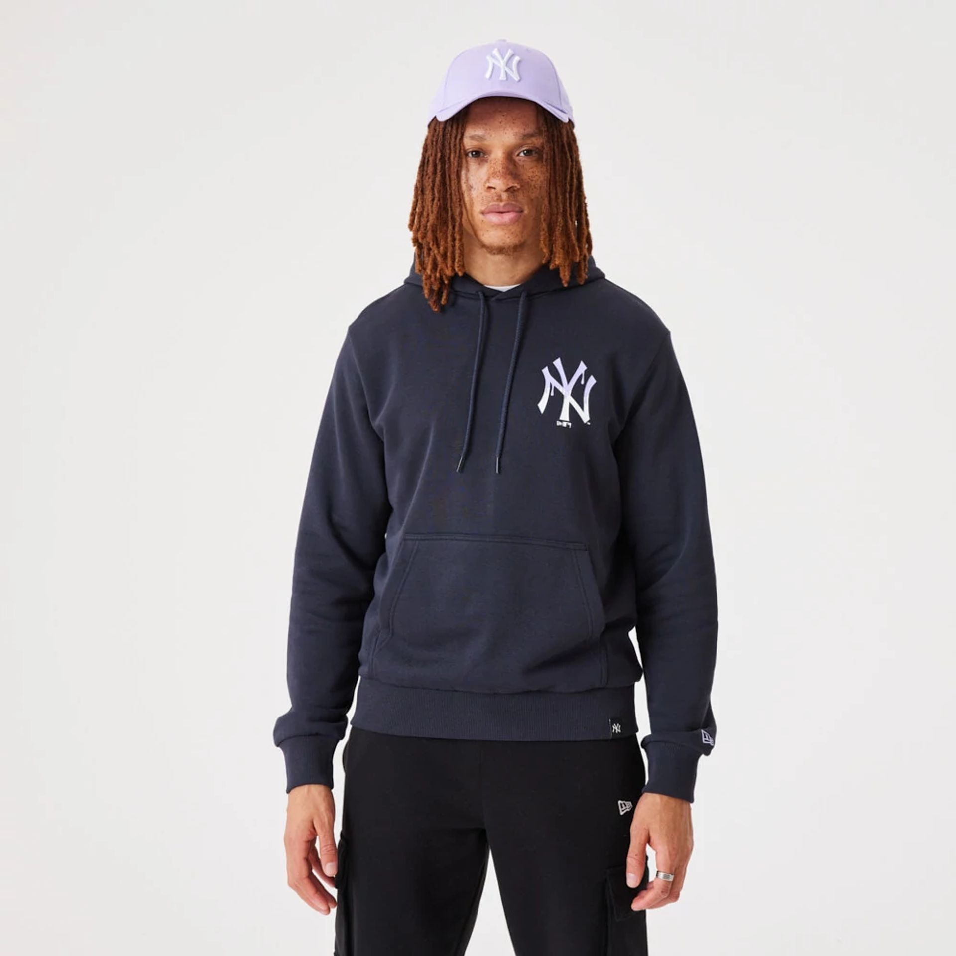 The Male model is wearing New York Yankees MLB Drip Logo Navy Pullover Hoodie 2