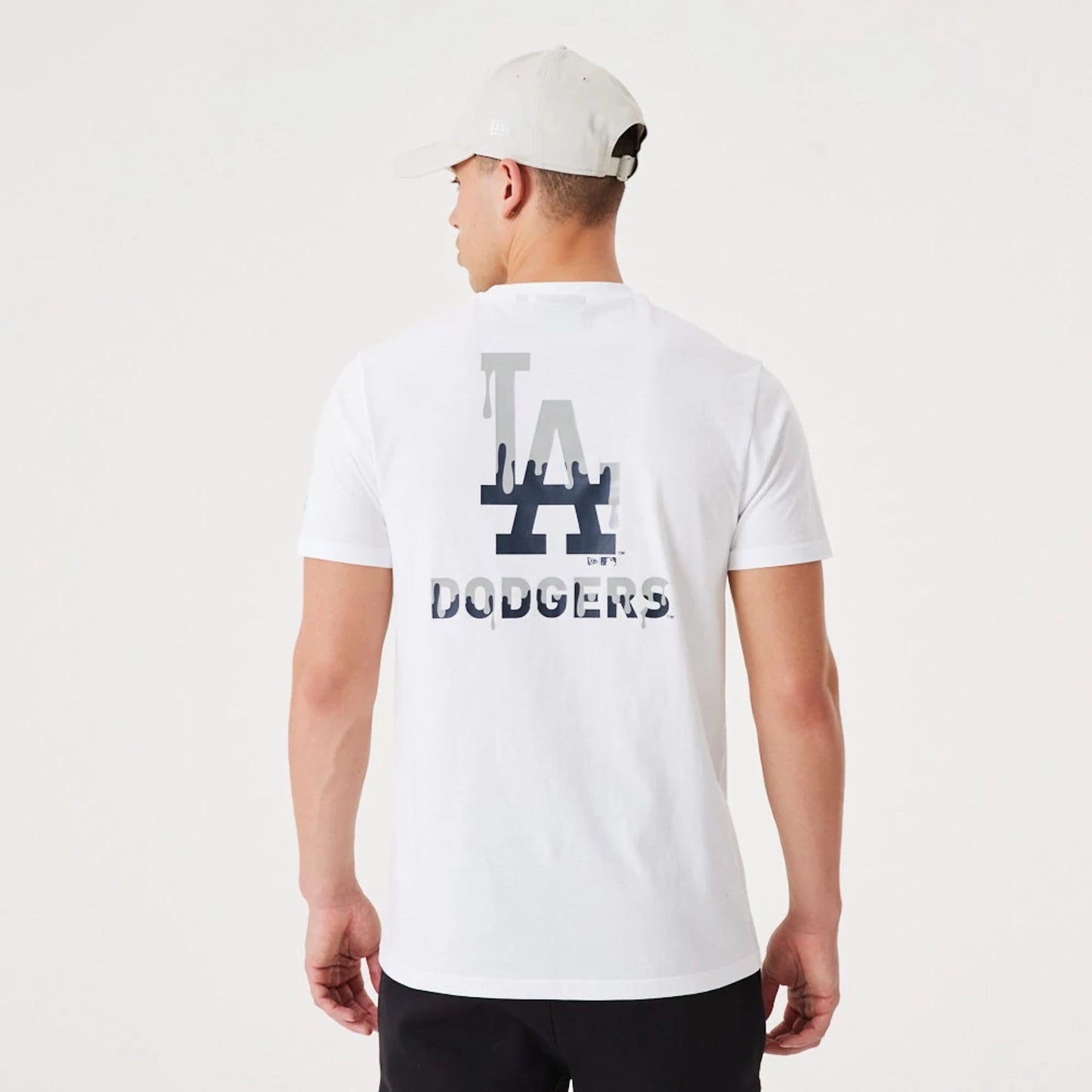 The Male model is wearing LA Dodgers MLB Drip Logo White T-Shirt 1