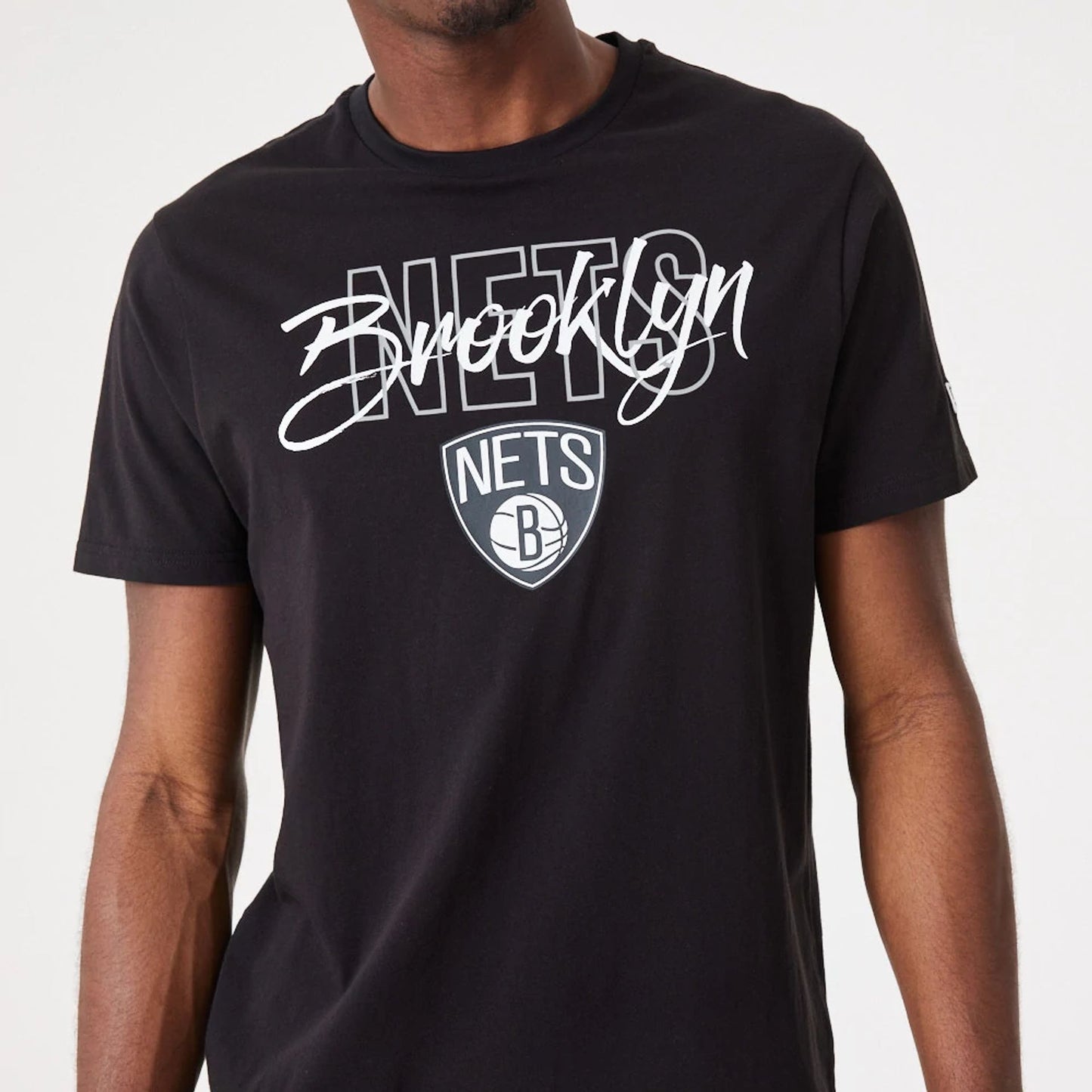 The Male model is wearing Brooklyn Nets NBA Script Black T-Shirt 6