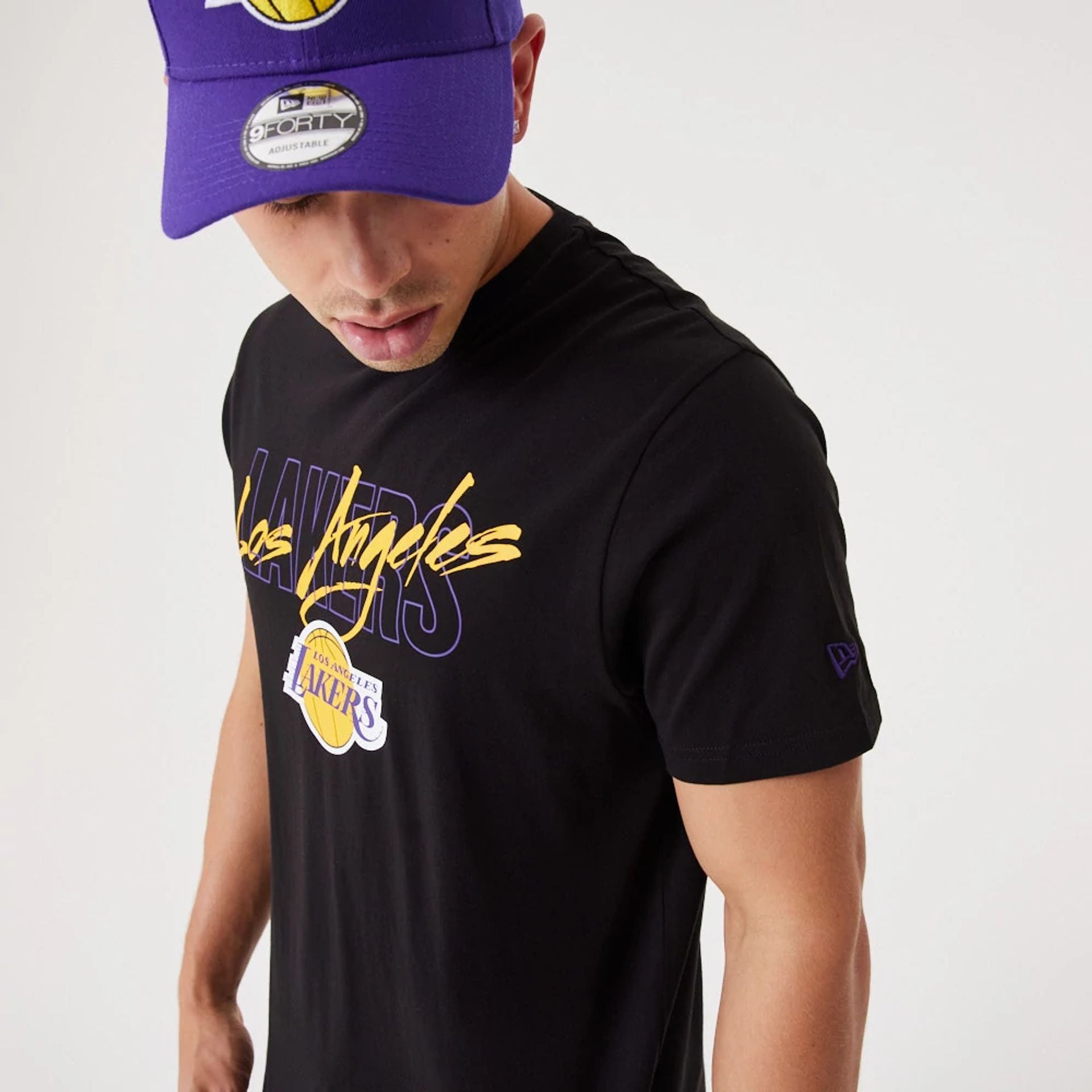 The Male model is wearing LA Lakers NBA Script Black T-Shirt 3