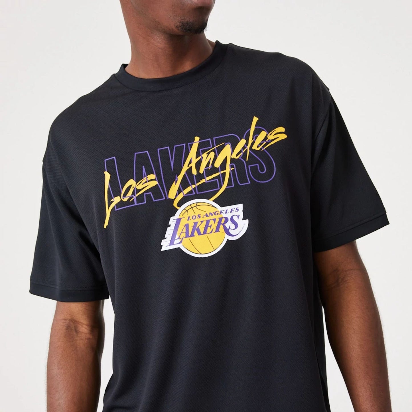 The Male model is wearing LA Lakers NBA Script Black Oversized T-Shirt 5