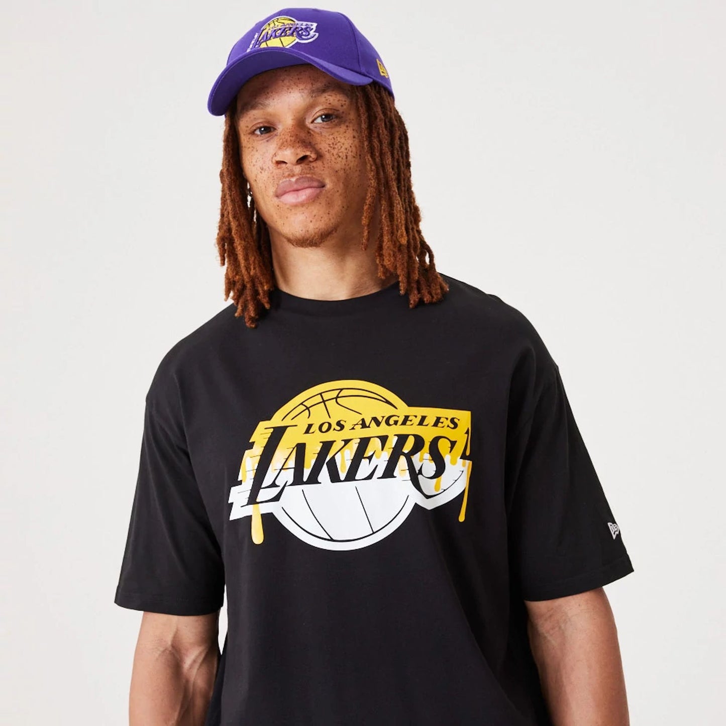 The Male model is wearing LA Lakers NBA Drip Logo Black T-Shirt 1