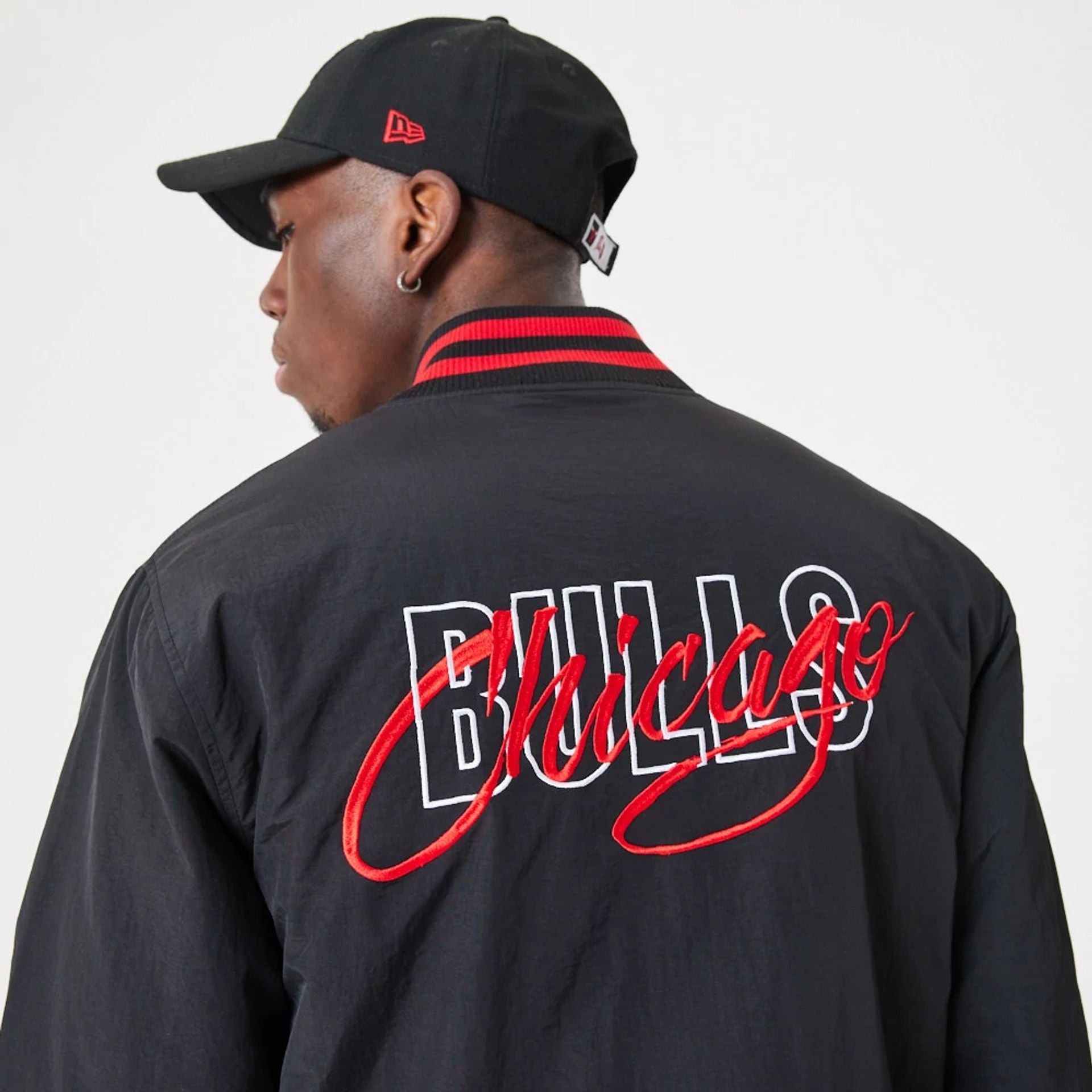 The Male model is wearing Chicago Bulls NBA Script Black Bomber Jacket 4