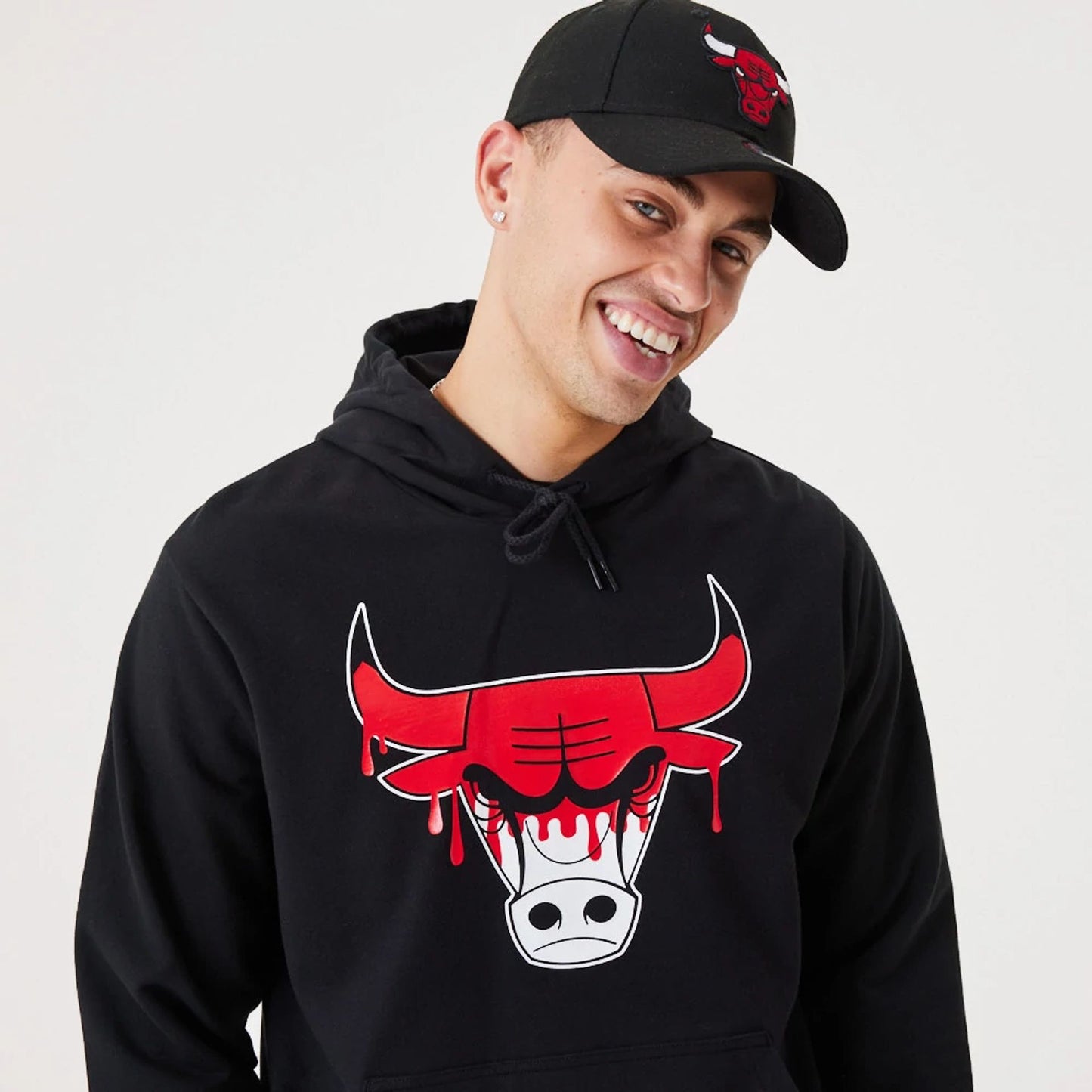 The Male model is wearing Chicago Bulls NBA Drip Logo Black Pullover Hoodie 3